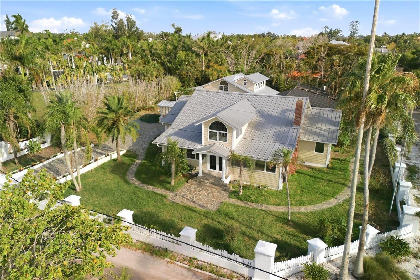 Currently under renovation. Welcome to an exceptional newly updated residence on he highly coveted Bay Island neighborhood on north Siesta Key, where timeless coastal architecture and modern luxury come together in one of Siesta Key’s most desirable locations. Situated on an expansive 0.48-acre homesite, this beautifully designed home offers 4,536 square feet of refined living space with a total of 6 bedrooms, 5 full bathrooms, and 1 half bath. Thoughtfully enhanced with new finishes, designer upgrades, and premium appliances throughout, the home also enjoys glimpses of the ocean water that complement its tranquil coastal setting. A private gated driveway leads to a detached 4-car garage, and guest suite with 2 bedrooms and 2 bathrooms, providing both privacy and convenience.

At the center of the residence is a stunning chef’s kitchen designed for both everyday living and entertaining, complete with premium Sub-Zero refrigeration, professional-grade gas appliances, custom cabinetry, elegant stone surfaces, and a spacious center island. The adjoining great room and dining area seamlessly connect to the outdoor living spaces, while the luxurious primary suite provides a private retreat with a spa-inspired bathroom, generous walk-in closets, and peaceful views of the surrounding tropical landscape.

Step outside to your own private coastal oasis, where a screened pool and expansive pool deck create the perfect setting for relaxation and entertaining year-round. Beautifully landscaped grounds and thoughtfully designed outdoor living areas enhance the home's resort-style atmosphere. Located just moments from Siesta Key’s world-renowned beaches, waterfront dining, boutique shopping, and Sarasota’s vibrant cultural amenities, this exceptional residence offers an unparalleled blend of privacy, sophistication, and convenience. A rare opportunity to own a luxury home on Norsota Way, where exceptional craftsmanship and the coveted island lifestyle come together. Photos and renderings may include virtual staging and virtual enhancements intended to illustrate the property's anticipated completion and design.