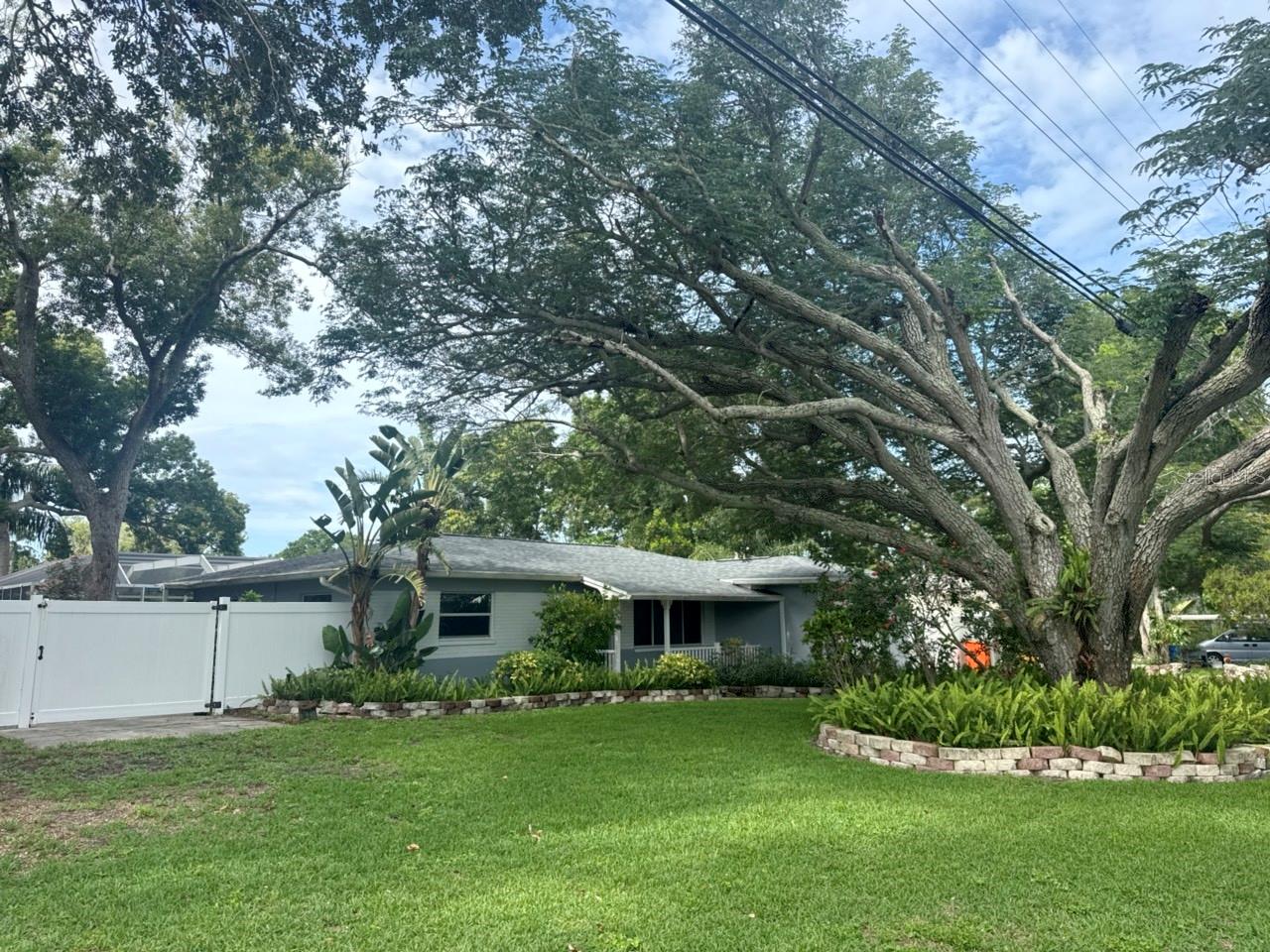 Welcome to this beautiful Seminole ranch-style home perfectly situated on a rare double lot in a high and dry, no flood zone location! This spacious property offers an open floor plan with a large eat-in kitchen ideal for entertaining and everyday living. The inviting family room features a cozy fireplace and opens seamlessly to the screened-in pool area, creating the perfect indoor-outdoor Florida lifestyle. The split bedroom floor plan provides privacy, with a spacious primary suite featuring a walk-in closet and an oversized bathroom complete with a separate tub and shower. Enjoy peaceful pond views, mature landscaping, and an expansive yard with endless possibilities for gardening, recreation, or play. The east side of the property includes a fenced concrete storage area perfect for RV or boat parking. Opportunities like this are rare — a spacious home on a double lot with room to spread out while still being just minutes from the gorgeous Pinellas County beaches, shopping, dining, and local amenities.
