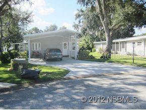 Beautiful 3 bedroom/2 bath, split plan home with open living room/dining room . Screened in porch off the living room. Recently painted inside w/light, bright colors. Newer carpet in Master and master bath redone w/new shower, sink, countertops and flooring. Double stack washer/dryer in utility room off the guest room. Kitchen has smooth top stove and a separate jennaire-counter top range. Wood flooring. Air is new in 2011 w/10 year warranty and new roof in 2010. New windows. Extremely well maintained home...must see to appreciate. ;Water: City