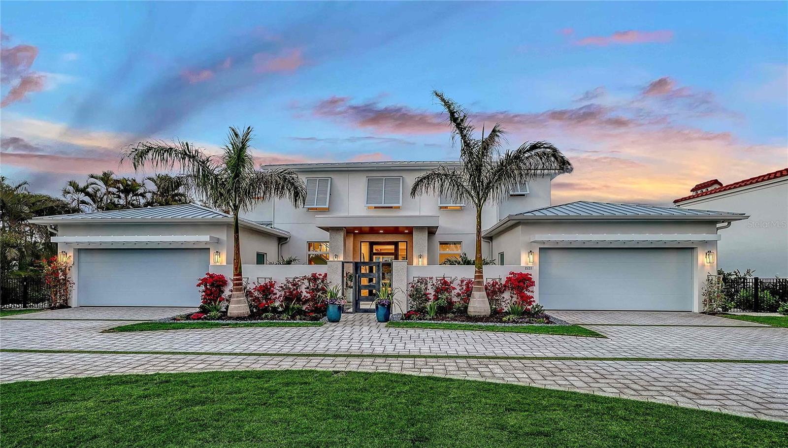The Windemere II is an extraordinary luxury custom home meticulously crafted by Heritage Builders. This coastal contemporary residence with clean lines is situated on a very rare West-of-Trail lakefront estate home site. The exquisite two-level residence redefines custom home living, flawlessly blending elegance, sophistication and comfort. As you step in the grand foyer, you are greeted by an expansive, open concept living space that seamlessly integrates the living, dining and kitchen areas. The gourmet kitchen is a chef’s dream, featuring top-of-the-line appliances, custom cabinetry and vast walk-in working pantry. This stunning home boasts four bedrooms, five luxurious baths and two convenient half baths. The primary suite, located on the first level overlooks the sparkling lake and features a designer bathroom private outdoor shower. For those who love to entertain, the Windemere II does not disappoint. Enjoy movie nights in the dedicated media room or host family gatherings in the versatile bonus room. A private study provides tranquil workspace. Ascend via the elegant custom staircase or convenient elevator to the upper level, where you will find two additional en-suite bedrooms, a large bonus room with wet bar and fitness room. Enjoy leisurely moments on the balcony overlooking the serene lake. Step through the massive pocketing sliding glass doors to discover your personal lakefront oasis – a breathtaking outdoor living retreat with a custom pool and spa and a fully equipped outdoor kitchen. Gather around the fire pit, perfect for cozy evenings under the stars. The Windemere II is not just a custom residence; it is a lifestyle. Experience the epitome of high-end-living and schedule a tour today! Floor plan located in attachments.