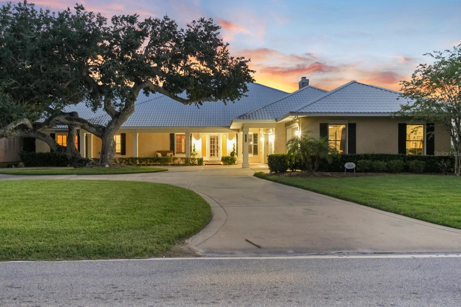 Experience luxurious riverfront living in this striking coquina-finished estate, gracefully updated and perfectly positioned along the Halifax River, just 2 minutes from Granada and all there is to enjoy in Ormond Beach. The elegant circular drive sets the tone for a property rich in Southern charm and modern sophistication.

Inside, generous living spaces span over 4,900 square feet, anchored by a split-floor plan that balances communal warmth with private retreat-like quarters. The chef’s kitchen shines with abundant granite and Corian surfaces, custom wood cabinetry, and double ovens—flowing into light-filled gathering spaces enhanced by plantation shutters, Intracoastal waterway views, and stunning sunsets .

Retreat to the lavish master suite, fitted with dual sinks, walk-in closets, a jetted tub, and a spa-worthy shower— cavernous and fit for room. An expansive second-floor “bonus” suite offers water views and endless possibilities—playroom, studio, home office, or teen haven.

Outside, unwind by the Italian-styled ledge pool or venture down to your private dock with a boat lift and deep water access for waterfront exploration and fishing. This home provides not just a residence, but a lifestyle—serene, elevated, and impeccably located on the water and minutes from beaches, upscale dining, and so much more.