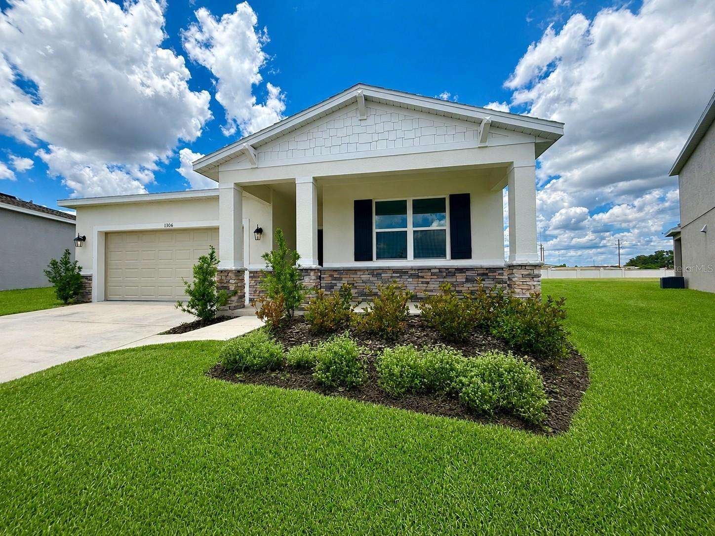 Better Than New! Be the one to call this beautiful home yours! Built in 2024 by Stanley Martin, this 4-bedroom, 2-bath home is truly better than new with upgrades already completed so you can move right in. The popular split-bedroom floor plan offers privacy while the open-concept design seamlessly connects the kitchen, dining, and living areas, creating the perfect space for entertaining or spending time with family.  Love low-maintenance living? You'll appreciate the all-tile flooring throughout the entire home—no carpet anywhere! The spacious primary suite features a huge walk-in closet and a private ensuite bath, while the additional bedrooms offer plenty of room for family, guests, or a home office. The kitchen overlooks the living and dining areas, making it easy to stay connected while cooking, and the washer and dryer are included for added convenience. The newly epoxy-coated garage floor provides a clean, polished look that's perfect for parking, storage, or hobbies.  Situated on an oversized 0.22-acre lot, there's plenty of room to enjoy the outdoors. Best of all, you'll be just a short walk from the community's outstanding amenities, including a resort-style pool, playground, soccer fields, and community mailboxes. Conveniently located just minutes from Lake Eva Community Park and Water Park, shopping, dining, schools, medical facilities, and major highways, this home offers the perfect balance of peaceful neighborhood living with quick access to everything Central Florida has to offer.  Rental homes this new with this many upgrades rarely become available for rent. Schedule your private showing today before this one is gone!