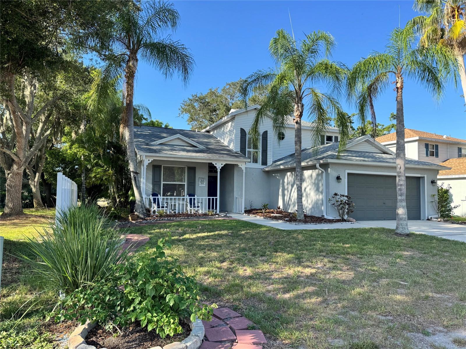 Experience the beauty of nature right outside your door, where sightings of herons, ibis, storks, osprey, eagles, and other native wildlife are part of everyday life! Beautifully maintained 3-bed, 2-bath home offers over 2,000 square feet of air-conditioned living space and a desirable split-bedroom floor plan. Bathed in natural light from its southern exposure, the home enjoys tranquil long-water views and exceptional privacy, with only one direct neighbor and a neighborhood park conveniently located next door. Tile flooring flows throughout the main living areas, for easy-to-maintain living. Updated eat-in kitchen featuring shaker-style cabinetry, granite countertops, stainless-steel appliances, and a raised breakfast bar perfect for casual dining or entertaining. Separate formal dining room provides an inviting space for hosting family gatherings and special occasions. Spacious first-floor primary suite features a large walk-in closet, water views,  and expansive ensuite bath with dual vanities, garden tub, and separate shower. One vanity area offers a separate entrance, allowing it to function conveniently as a powder room for guests. Step outside and enjoy Florida’s year-round outdoor lifestyle from the enclosed panoramic screened lanai (2021), where uninterrupted water views provide the perfect backdrop for morning coffee or evening relaxation. New roof (2018), no CDD fees, and exceptionally low HOA fees. Ideally situated just 2 miles from I-75, this home offers easy access to Costco, Lakewood Ranch, premier golf courses, UTC shopping and dining, and is only 17 miles from the beautiful Gulf beaches and the charm of Anna Maria Island.