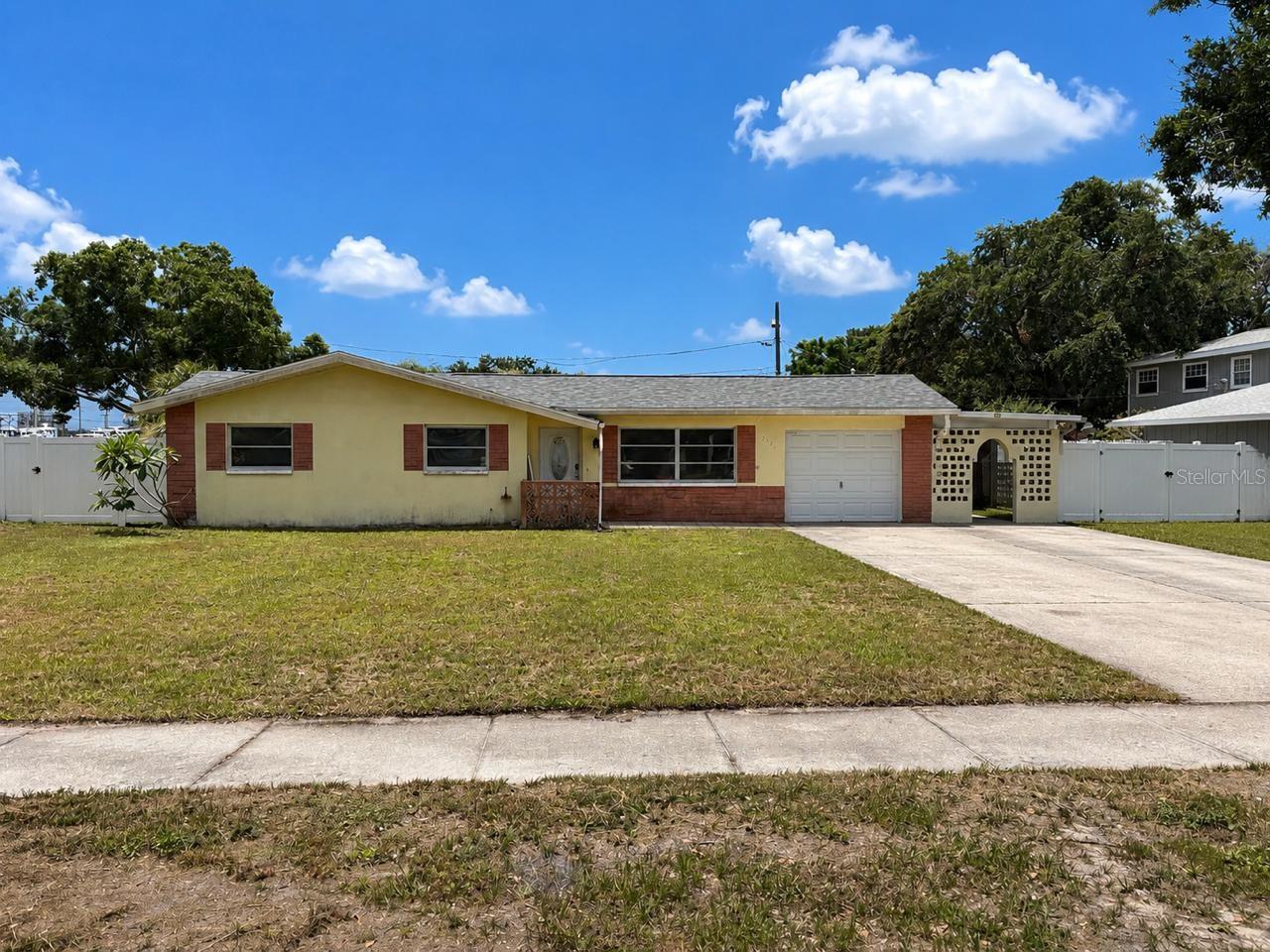 Welcome to this charming 3-bedroom, 1-bath home in the heart of Clearwater! Priced to sell, this home features a newer roof and hot water heater, providing added peace of mind.

Step outside to enjoy the oversized backyard with a large AstroTurf area for low-maintenance living, plus a spacious patio that’s perfect for entertaining, grilling, or relaxing. The home also offers a one-car garage, an additional storage area at the rear of the house, and an oversized driveway with plenty of parking.

Conveniently located just minutes from Clearwater’s beautiful beaches, downtown Clearwater, and the airport, this home offers easy access to shopping, dining, entertainment, and major roadways.

Whether you’re a first-time homebuyer, downsizing, or looking for an investment opportunity, this home checks all the boxes. Priced to sell—don’t miss your chance to own this fantastic property before it’s gone! Some photos have been virtually staged.