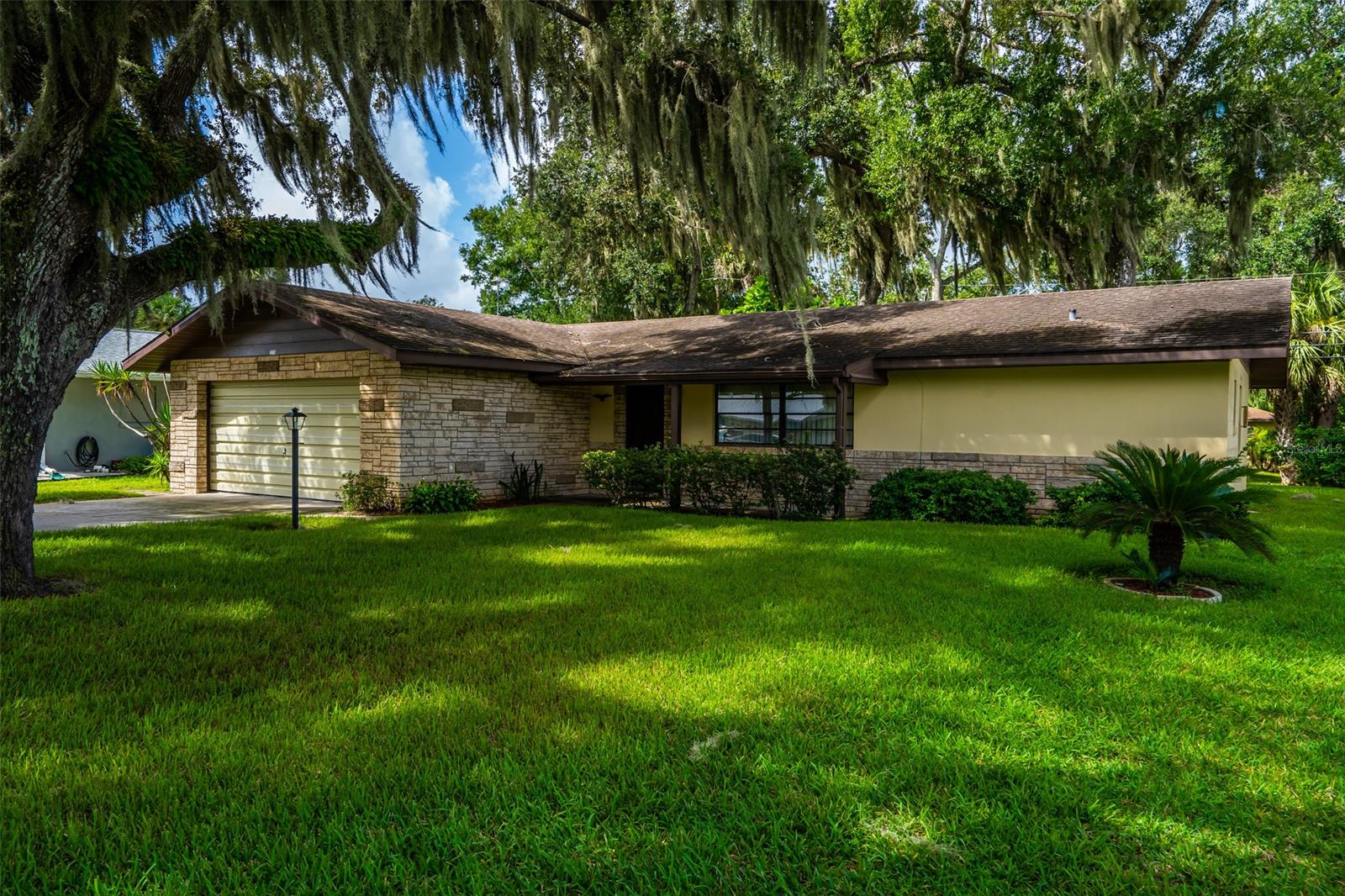Honey stop the car!  You will love this 2 bedroom, 2 bathroom home with a 2 car garage and beautiful yard! Living room has recently installed vinyl laminate flooring and very open feel.  There's a large picture window that brings natural light in the living room. Dining area is right off kitchen and has sliding glass doors leading to the large screen porch.  Porch is great for enjoying cool evenings and has newer outdoor carpeting. What a great kitchen with plenty of cabinets and countertop space. Tile backsplash and vinyl laminate flooring were recently installed. Newer refrigerator and microwave. If you love to cook with gas, you've got it here! Range is propane fueled. Roomy master bedroom has walk in closet and standing shower in master bathroom. Beautiful tile backsplash was recently installed over master vanity.  Guest bedroom and bathroom are in opposite side of house, perfect for kids or family. This home is close to grocery store and restaurants.  If you like the water and everything it has to offer, there are several city parks with boat launches along the river! ;Water: City