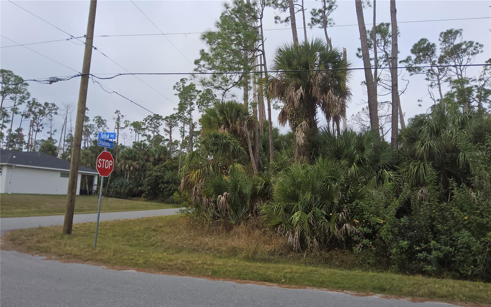 Build your dream home on this oversized corner residential lot located in the thriving city of North Port. The lot is Flood Zone X (No flood insurance required) with no HOA, no CDD fees, and no deed restrictions. This area is located close to the North Port Aquatic Center, the water park that features a 25-meter stretch pool, three slides, and a lazy river. It is also minutes away from shopping, dining, schools, medical facilities, and North Port’s rapidly growing amenities. I 75 and RT 41 provide access to everything that Southwest Florida has to offer.  Additionally, Warm Mineral Springs, gorgeous Gulf beaches, multiple community parks, golf courses and the Atlanta Braves spring training facility are just a few miles down the road. This is a charming residential area in Southwest Florida’s desirable and upcoming areas.
