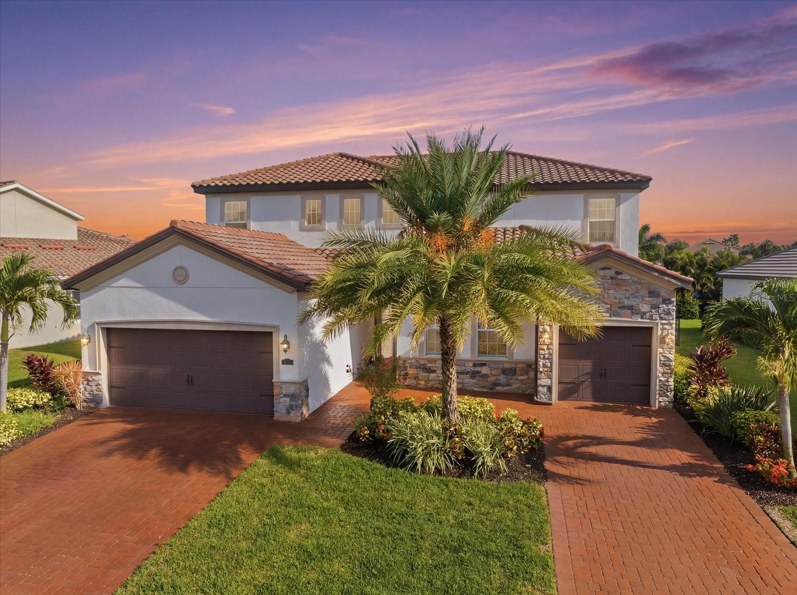 LAKEWOOD RANCH NEXT GEN HOME WITH PRIVATE IN-LAW SUITE @ ARBOR GRANDE! Experience the perfect blend of luxury, flexibility, and multi-generational living in this beautifully upgraded two-story residence, ideally situated on a picturesque cul-de-sac directly across from the clubhouse, resort-style amenities, and park in the highly sought-after gated community of Arbor Grande. An additional private gate provides convenient direct access to Bob Gardner Park, offering endless outdoor recreation just steps from your front door. Designed for today's lifestyle, the private IN-LAW SUITE offers complete independence with its own private entrance, full kitchen, living area, laundry, bedroom, one-car garage, and extensive custom storage, including built-in closets, garage cabinetry, drawers, and organizational systems. It is the perfect space for extended family, guests, a live-in caregiver, college-aged children, or a private home office. The main residence features FIVE spacious bedrooms, 3.5 baths, and an expansive LOFT/BONUS ROOM ideal for a media room, playroom, or additional gathering space. Elegant upgrades throughout include soaring ceilings, crown molding, additional decorative molding, custom wall paneling in the breakfast area, a built-in entertainment center in the great room, custom pantry shelving, built-in cabinetry and drawers in the hallway storage closet, and professionally designed custom closets in the primary suite and an additional upstairs bedroom. Outdoor living is exceptional with an oversized extended screened lanai designed for year-round enjoyment. A large motorized retractable awning provides shade across the lanai, while a motorized retractable privacy/sun screen offers additional comfort and protection. The included gazebo creates another inviting outdoor living space, all surrounded by lush tropical palms that provide outstanding privacy and a true Florida resort-like setting. Arbor Grande is a premier natural gas community known for its distinctive architecture, tile roofs, paver driveways, and exceptional amenities, including a beautifully appointed clubhouse, fitness center, heated beach-entry pool, bocce ball, sand volleyball, and three private gated entrances to Bob Gardner Park with soccer fields, playgrounds, dog parks, and frisbee golf. Located just minutes from Lakewood Ranch Main Street, Waterside, premier shopping, dining, top-rated schools, and approximately 35 minutes from the Gulf Coast's world-famous beaches, this exceptional home offers an unmatched combination of luxury, privacy, functionality and true resort Florida lifestyle!