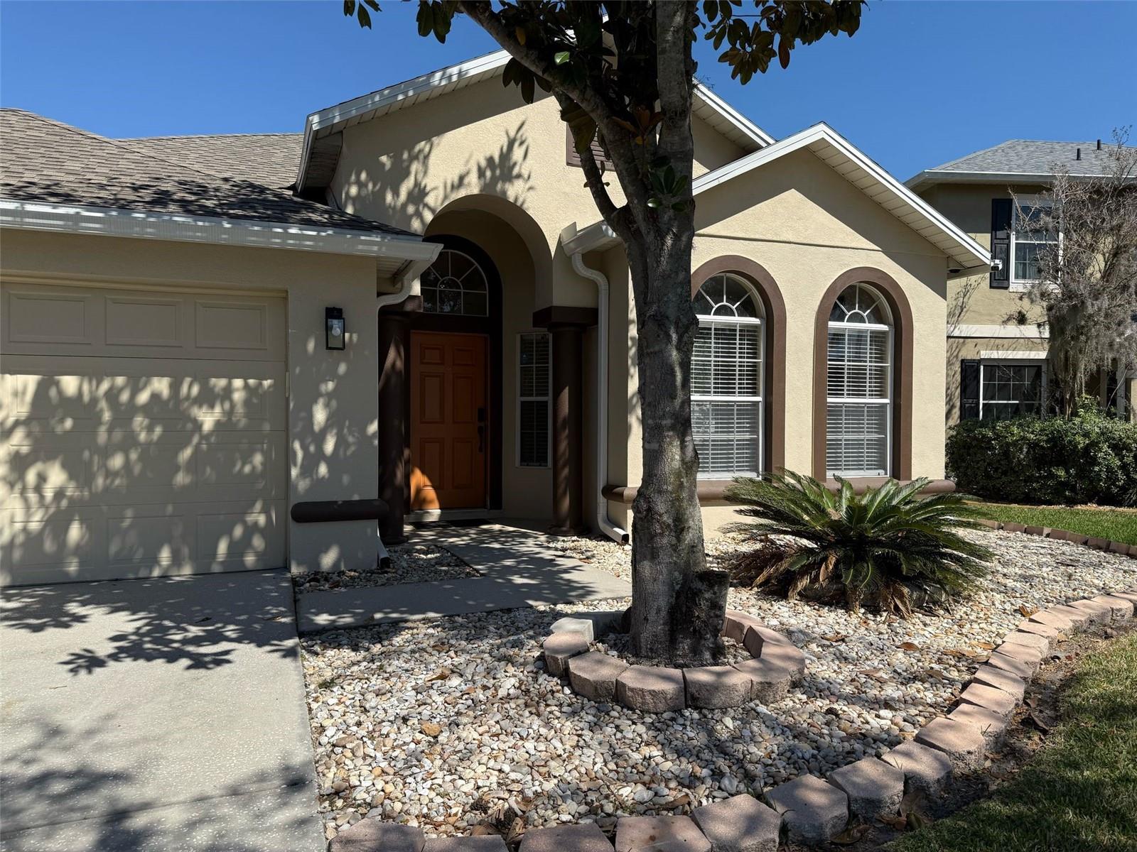 Welcome to this beautifully maintained 4-bedroom, 2-bath home located in the highly desirable gated golf community of Stoneybrook West in Winter Garden. This move-in-ready residence features an open and spacious floor plan with separate living and dining areas, high ceilings, abundant natural light, and ceramic tile throughout. The upgraded kitchen offers granite countertops, ample cabinet space, and all appliances are included. The spacious primary suite features a large walk-in closet and an updated bathroom with skylights, dual vanities, a garden tub, and a separate shower. Enjoy outdoor living in the fully fenced backyard with a large patio, perfect for entertaining or relaxing. Recent updates and meticulous care make this home a true standout. Roof replaced in 2021. Property comes with solar panels. Residents enjoy resort-style amenities including a community pool, fitness center, tennis and basketball courts, playgrounds, lake access, fishing pier, boating, and 24-hour guarded gate security. Conveniently located near top-rated schools, shopping, dining, major highways, downtown Winter Garden, and Orlando's world-famous attractions. Don't miss this exceptional opportunity—schedule your private showing today!