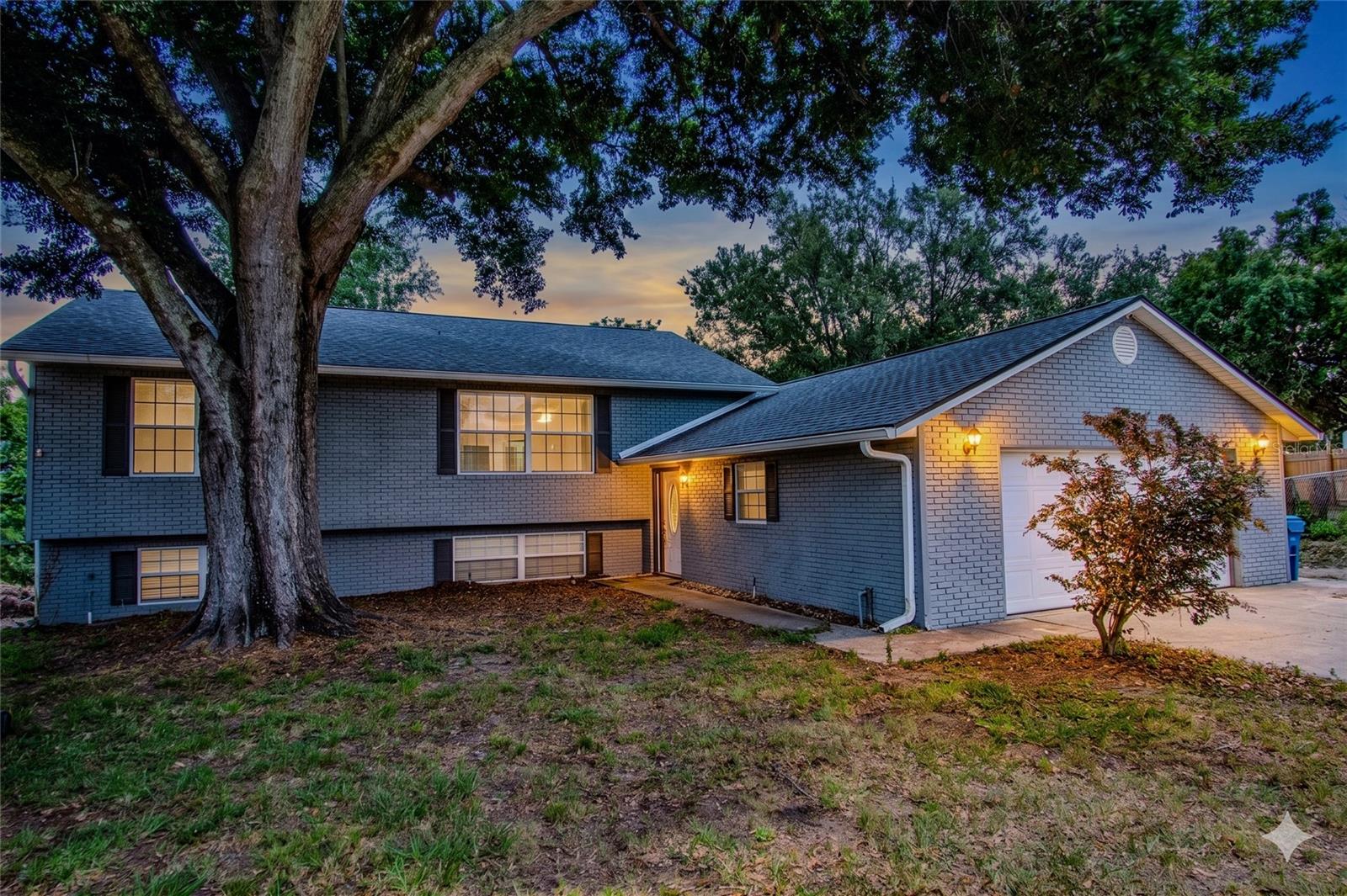 One or more photo(s) has been virtually staged. **Move-in ready lakefront home with NO HOA in beautiful Haines City!** Enjoy Florida living at its finest from this well-maintained home situated along the peaceful shores of Lake Moore, offering serene lake and preserve views from many rooms throughout the home. This attractive split-level residence features spacious living areas, a large deck overlooking the water, and plenty of room to relax, entertain, and enjoy the outdoors.

The home has been thoughtfully updated and is ready for its next owner, featuring a **new roof in 2026**, **new deck added in 2026**, fresh interior paint, triple-pane windows, and a storm-ready exterior with built-in screws for easy and secure window coverings. The updated kitchen offers granite countertops, a gas stove, and a functional layout that opens comfortably to the living spaces. Additional features include a gas water heater, sprinkler system, fenced yard, and generous storage throughout.

The downstairs level boasts an enormous **29' x 21' living room**, providing incredible flexibility for a family room, game room, media space, or entertaining area. The garage offers room for **two vehicles plus workshop space**, making it ideal for storage, hobbies, or projects. With large living spaces throughout, a split-level floor plan, lake views, and an updated move-in-ready interior, this home offers comfort, function, and lifestyle in one package.

Step outside to your own private Florida paradise, where the beautiful new deck overlooks the lake and preserve setting. Whether you are enjoying morning coffee, or entertaining guests, this property captures the peaceful waterfront lifestyle buyers are looking for.

Conveniently located near **Highway 27 and I-4**, this home provides excellent access to both the **Orlando and Tampa areas**, while still offering a quiet lakefront setting. Nearby shopping, recreation, employment centers, fire department access, and daily conveniences make this an ideal Central Florida location.

**Lakefront, updated, move-in ready, NO HOA, and convenient to everything — this is a must-see home! Call today to schedule your private showing.**