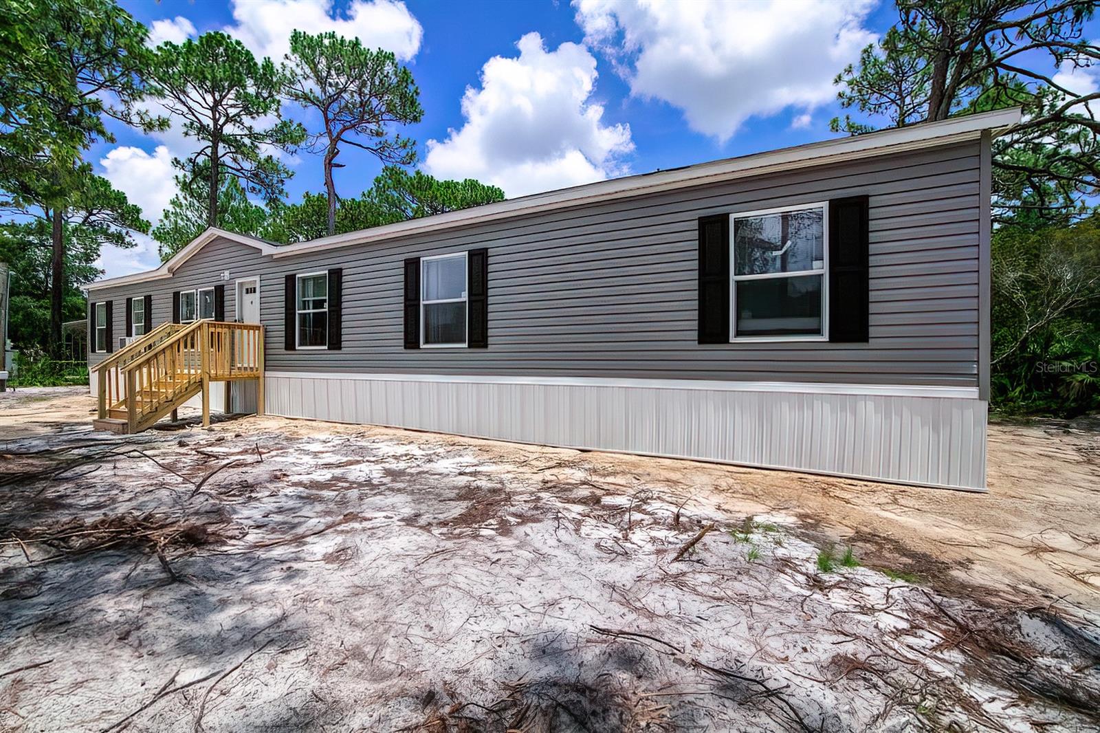 If space is what you have been looking for, then look no further. This brand new 2023 home offers 5 bedrooms and 3 full bathrooms with over 2,100 square ft and sits on just over an acre!! The master bathroom has double sinks for his and hers, a walk-in closet, a comfy garden tub and a separate standalone shower! All 4 extra bedrooms are perfect in size and will fit a twin or queen bed nicely. You will enjoy cooking in this open and roomy kitchen that offers plenty of cabinet and pantry space. On the far end of the house is an extra family/sitting room, that could easily be turned into an office or game room if desired. The property is slightly over an acre that was recently cleared, with a few buffering trees between neighbors for privacy and shade. Brand new 10x20 shed in the backyard for all your extra needs. Everything is NEW! New AC, New septic, New hot water heater, you name it! On city water! The neighborhood is pleasantly peaceful and quiet. Inglis is an enjoyable laid back and rural area that is not far from lake Rousseau and within close driving distance to Crystal River which is known for its beautiful springs and manatees. 45 minutes to Gainesville where you'll find the best doctors and specialist in the state. A few finishing touches are still being done inside and a gravel driveway will be done as well. Home is owner occupied, private showings only!
