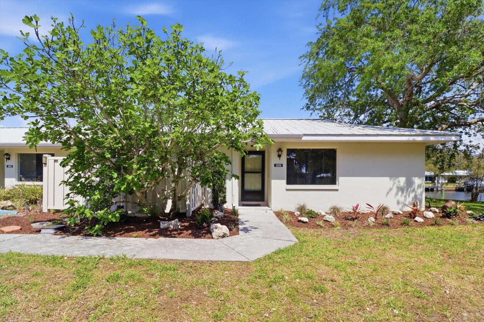 One or more photo(s) has been virtually staged. WHO SAYS THERE AIN’T NO SHANGRI-LA? This 2BD/2BA FULLY REMODELED 2026 end unit condominium is located in a private, 44-acre waterfront community in Crystal River along the Gulf. This idyllic hideaway is surrounded by a mosaic of salt marshes and is home to wildlife galore, from dolphins and otters to heron and bald eagles. As if your utopia couldn’t get any better, this condo’s curb appeal draws you in with its full landscaping and outdoor lighting. Once inside you will notice that you are free to conceptualize, colorize and sensationalize! Make it your own! The open floor plan allows the living room to open to a large, Florida sunroom that floods the home with an abundance of light and provides additional space for entertaining family and friends, while also being able to enjoy relaxing waterfront views from the place you call home. This stylish galley kitchen showcases sleek NEW WHITE SHAKER CABINETRY and a full suite of NEW STAINLESS-STEEL APPLIANCES. Complemented by NEW LVP FLOORING that adds durability and a modern cohesive finish throughout. Step out onto the patio for morning coffee, afternoon tea or a quiet retreat. In unit laundry room has plenty of space for storage. No shortage of closet space throughout. NEW HVAC and NEW WATER HEATER 2025 is a plus, along with a NEW METAL ROOF replaced in 2021! Don’t forget to use the amenities and take a dip in the heated pool, after your tennis match or round of golf at any one of the nearby golf courses! Downtown Crystal River is about 10 minutes away for shopping and restaurants. Three Sister Springs and Hunter Springs Park are only 5 miles away for boating, fishing, beautiful nature walks & the only place to SWIM W/ THE MANATEES! FREE 1yr HOME WARRANTY is OFFERED!