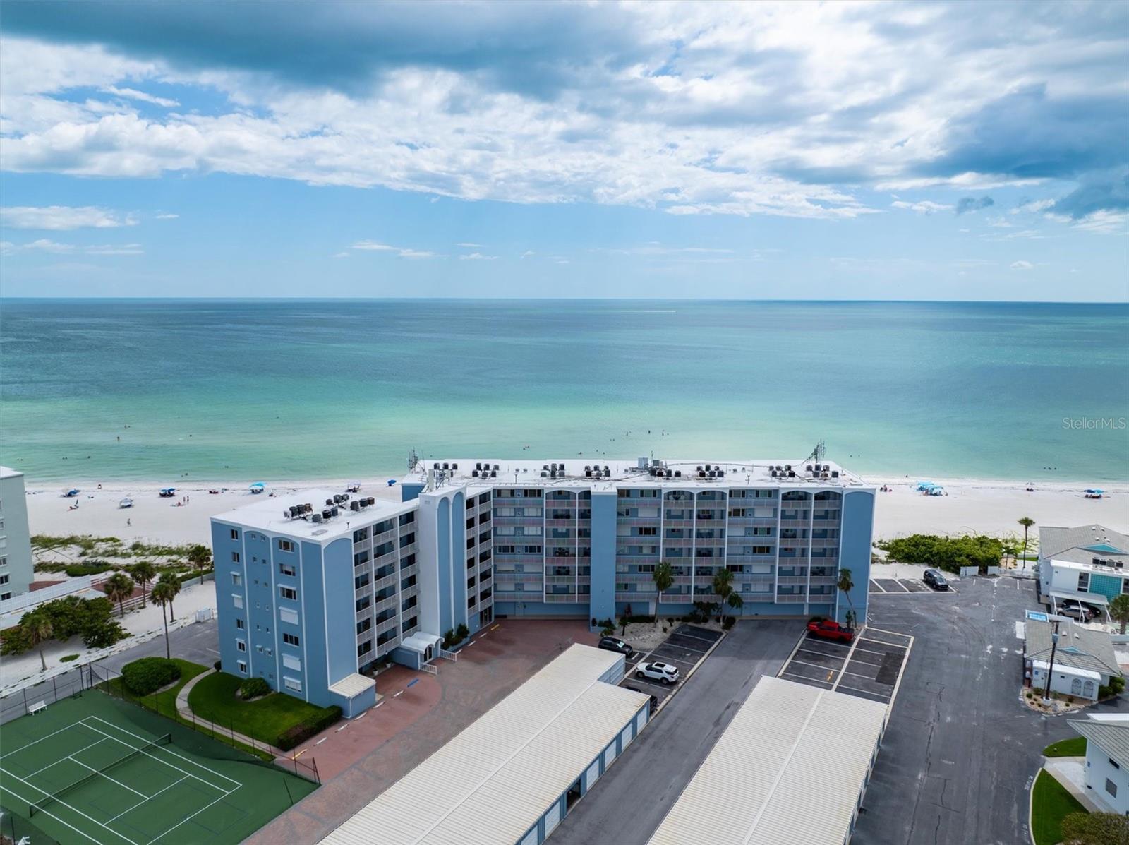 Never miss a sunset with the view from this beachfront GEM! A true 3 Bedroom, 2 Full Bathroom with 1,516 square feet, including an indoor Laundry Room. One of only 6 units of this size in the building. The Master Suite boasts a panoramic beach view, walk in closet and en-suit bath, while the 2 remaining bedrooms have large closets and comfortable natural lighting. The split floor plan ensures privacy for guests and the open Kitchen, Dining and Living Room combo is perfect for entertaining. Includes 2 private garage spaces, and a storage room/workshop, creating ample storage for all of your beach toys and Gulf Cart! Located in the heart of Holmes Beach, one of the most desirable areas on Florida's Gulf Coast, steps from world class dining, shopping, fitness, boating, and family friendly activities. The Martinique North building showcased its strength during the 2024 Hurricane Season, only suffering minor damage to the grounds and garages. Don't miss this rare opportunity to own a slice of paradise!