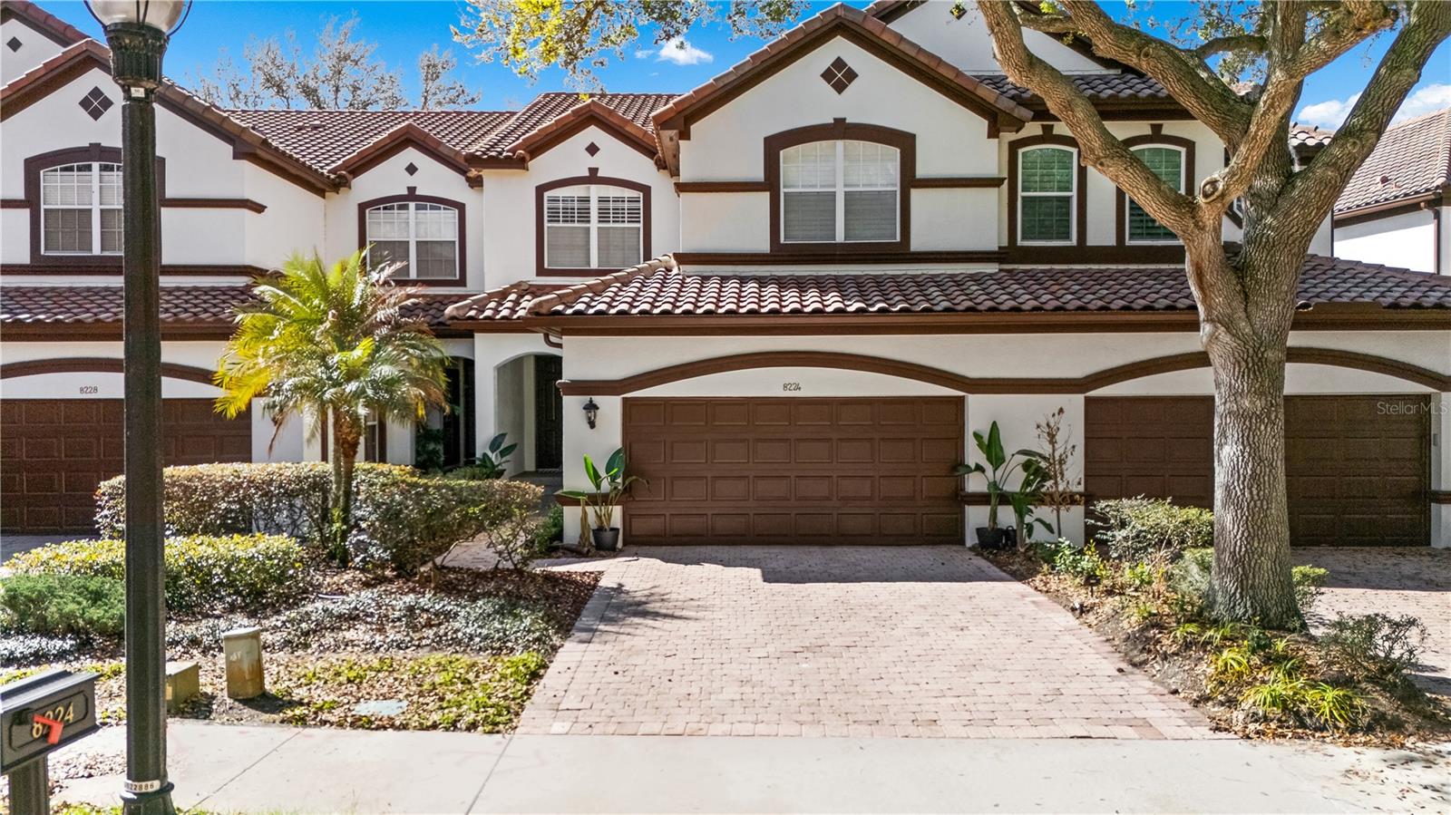 Absolutely stunning LAKEFRONT town home with breathtaking water views in the highly sought-after guard-gated community of Vizcaya, right in the heart of Dr. Phillips! Step through the impressive 8-foot entry door and immediately notice the fresh interior paint, elegant crown molding, and magnificent engineered hardwood flooring flowing throughout the main level. Natural light pours into the home, creating a warm and inviting space that truly feels special. The first floor offers two spacious living areas, both showcasing spectacular lake views, the perfect backdrop for relaxing evenings or entertaining friends and family. Step outside onto the expansive deck overlooking the water, an ideal place to gather with loved ones or unwind at the end of the day while enjoying the peaceful lakefront setting and the lifestyle this beautiful home offers. The chef-inspired kitchen is a true showpiece, featuring real wood cabinetry with upper and under-cabinet lighting, exotic granite countertops with a bullnose finish, stainless steel appliances, and a beautiful breakfast bar that flows seamlessly into the dining nook. Downstairs also offers a generous laundry room with sink and ample cabinet storage. TANKLESS WATER HEATER and NEW HVAC (2024) provide peace of mind and make this home truly move-in ready, just bring your bags! Upstairs, durable stain-resistant Berber carpet leads you to two expansive loft areas offering endless possibilities for a home office, media room, or additional living space. The primary suite is a true retreat featuring a beautiful bay window as well as a fabulous balcony where you can even catch fireworks in the distance, especially on holidays! Enjoy a spacious walk-in closet with custom organizer and a private balcony perfect for sipping your morning coffee while taking in peaceful lake views. The en-suite bath features a relaxing jacuzzi tub, walk-in shower, and dual vanities. Two additional guest bedrooms are generously sized with walk-in closets, newer ceiling fans with lights and share a convenient Jack-and-Jill bathroom. Vizcaya offers resort-style living with amenities including a community pool, fitness center, gated dog park, and picnic areas. Located walking distance to Restaurant Row and zoned for A-rated schools, with easy access to I-4, Orlando International Airport, and Central Florida’s world-class shopping, dining, and entertainment. Lakefront end-unit opportunities in Vizcaya are rare, schedule your private tour today and experience it for yourself!