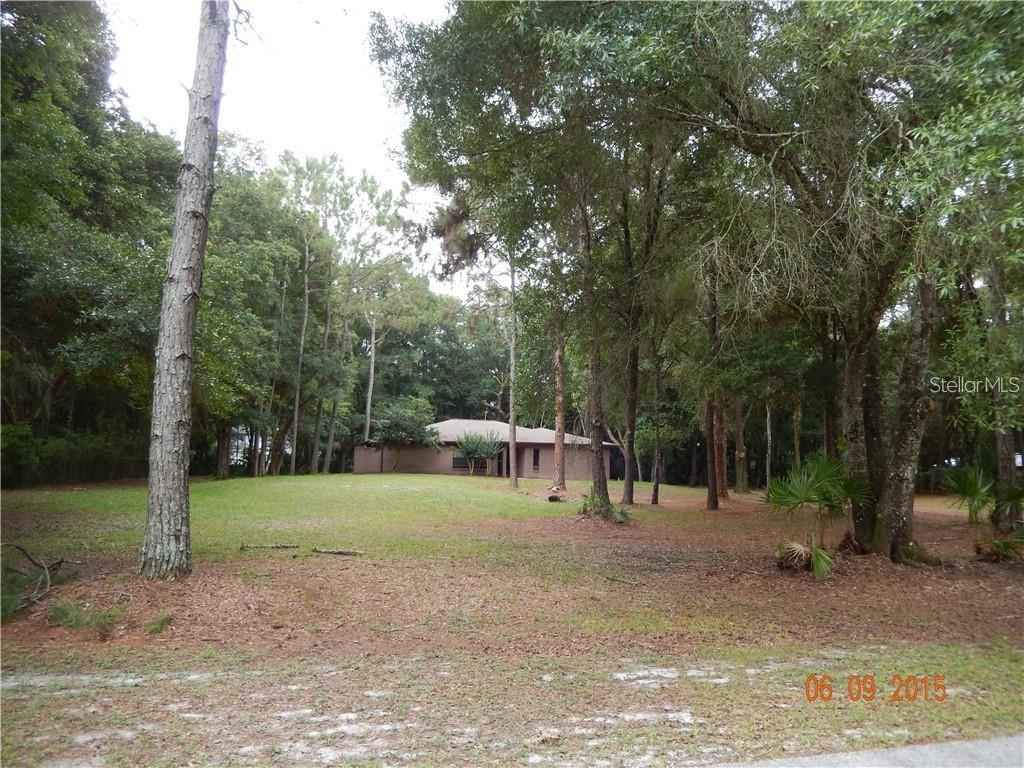 If you are looking for peace and quiet and privacy this home has it all. There are deer on the property daily, no yard dogs. The home was remodeled top to bottom several years ago. Just a year ago painted throughout.  Porcelain Tile and laminate floors throughout. Kitchen has wood cabinets all quiet close drawers, beautiful Grey Granite counters, Stainless steel appliances with a large pass through to the over 500 sq ft. screened in patio. 1.5 acres of land so you can park your boat. There is an unusable fireplace and much, much more.