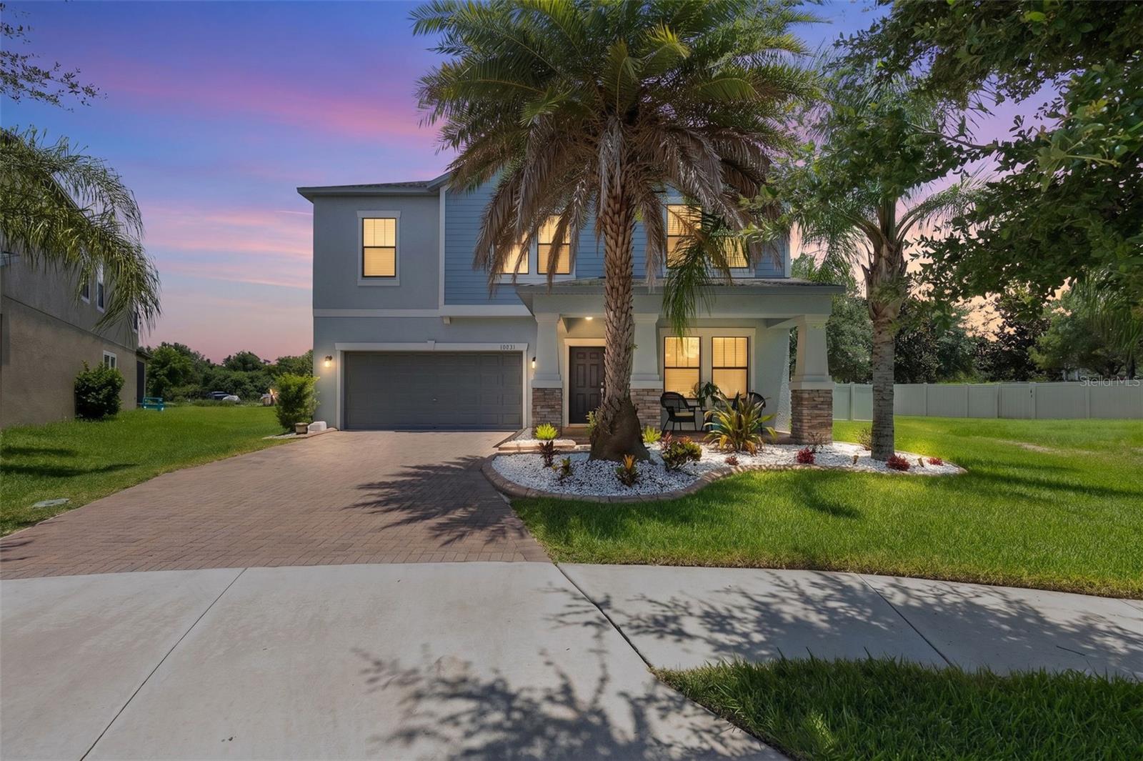 HGTV CALLED… YOUR DREAM HOME IS READY! PERFECTLY POSITIONED ON A CUL-DE-SAC AND COMPLETE WITH A RESORT-STYLE HEATED SALTWATER POOL, WATERFALL, SPA & OVERSIZED SUN SHELF! Why wait for new construction when you can own this beautifully upgraded, move-in ready home loaded with designer touches, luxury features, incredible entertaining space, and a layout today’s buyers dream about? Perfectly situated on a desirable cul-de-sac, this stunning home offers the perfect blend of luxury, functionality, and unforgettable indoor-outdoor Florida living. From the moment you walk in, you’ll notice the warm modern finishes, magazine-worthy design, abundant natural light, and thoughtful upgrades throughout. At the heart of the home is a chef’s dream kitchen designed to impress! Featuring an oversized kitchen island with breakfast bar seating, an abundance of cabinetry for exceptional storage, gorgeous high-end Samsung BESPOKE appliances, and ample prep space, this kitchen was made for hosting holidays, entertaining friends, or simply enjoying everyday life in style. Need storage and functionality? You’ll appreciate the large walk-in pantry PLUS a stylish butler’s pantry/coffee bar area with additional quartz workspace, perfect for your morning coffee station or extra prep space. Luxury finishes continue throughout with beautiful Quartz countertops in the kitchen, bathrooms and the built-in hallway workspace station, creating a cohesive upscale feel you will love. The spacious great room creates the perfect gathering space and showcases a stunning custom in-wall electric fireplace feature wall, bringing warmth, ambiance, and a true designer feel to the home. The primary retreat is truly unforgettable featuring a custom designer accent wall, oversized bedroom, spa-inspired ensuite bath with dual vanities, soaking tub, separate shower, and an impressive oversized walk-in closet that feels like its own room. Upstairs offers incredible flexibility with a huge bonus/media room featuring a custom entertainment wall, creating the perfect space for cozy popcorn and movie nights, gaming, a teen retreat, playroom, or second family room. Secondary bedrooms are generously sized, with two bedrooms featuring walk-in closets, providing the kind of storage space buyers are always searching for. Even better, the upstairs laundry room offers everyday convenience exactly where you need it most. And then comes the showstopper… Step into your own private backyard paradise featuring an amazing oversized SALTWATER pool complete with a beautiful waterfall feature, relaxing spa, and oversized sun shelf, perfect for lounging in the water, entertaining guests, or soaking up the Florida sunshine year-round. Whether you're enjoying morning coffee poolside, hosting unforgettable gatherings, or unwinding after a long day, this screened outdoor retreat feels like your own private resort. Even better, the convenient first-floor guest half bath offers direct access to the pool area, the perfect Florida pool bath setup for family and guests. UPGRADES: 2024: Premium Samsung BESPOKE Appliances: Refrigerator, Range, Microwave & Dishwasher, Samsung Front-Load Washer & Smart Dryer. 2025: EcoWater Whole-Home Water Softener System for enhanced water quality and everyday comfort. Designer finishes, incredible storage, abundant natural light, oversized entertaining spaces, and resort-style outdoor living make this home truly stand out from the ordinary. Electric Car charger included.