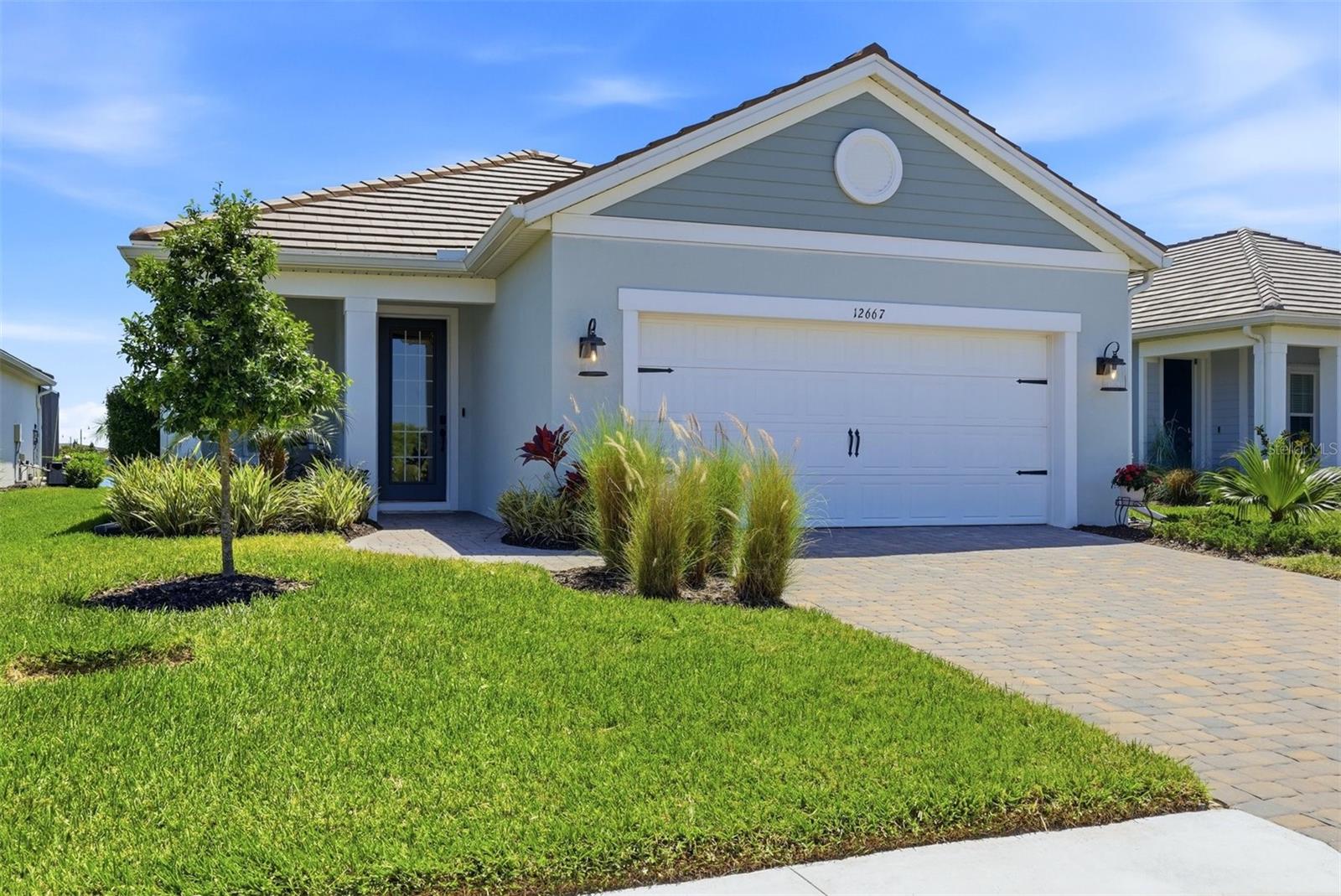Welcome to this beautifully elevated, model-like home located in the highly desirable Wellen Park area of Venice! This stunning residence offers the perfect blend of style, comfort, and Florida lifestyle living.
Step inside to find ceramic tile flooring throughout, elegant crown molding, and plantation shutters that add a timeless touch. The open-concept design showcases a gorgeous kitchen featuring quartz countertops, natural gas cooking, and ample space for entertaining. Quartz continues into the bathrooms, creating a cohesive and upscale feel throughout the home.
The spacious layout includes three bedrooms, all with walk-in closets, while the primary suite offers added convenience with two linen closets. Thoughtful upgrades such as built-in shelving and a custom accent wall elevate the home’s designer appeal.
Enjoy true Florida outdoor living with a private pond view from your screened-in, caged lanai, enhanced by a clear view screen that allows you to fully take in the serene water views. The lanai is also equipped with hurricane screens for added protection. Relax in your saltwater pool and spa, featuring a desirable tanning shelf—perfect for soaking up the sun.
Additional highlights include hurricane impact windows throughout and an epoxy-finished garage floor for both durability and style.
Residents also enjoy access to a community amenity center featuring a resort-style pool and pickleball courts. Best of all, you’re just a short golf cart ride away from Downtown Wellen Park, where you’ll find restaurants, shops, and vibrant entertainment options.
This home truly has it all—style, upgrades, and an unbeatable location. Schedule your private showing today!