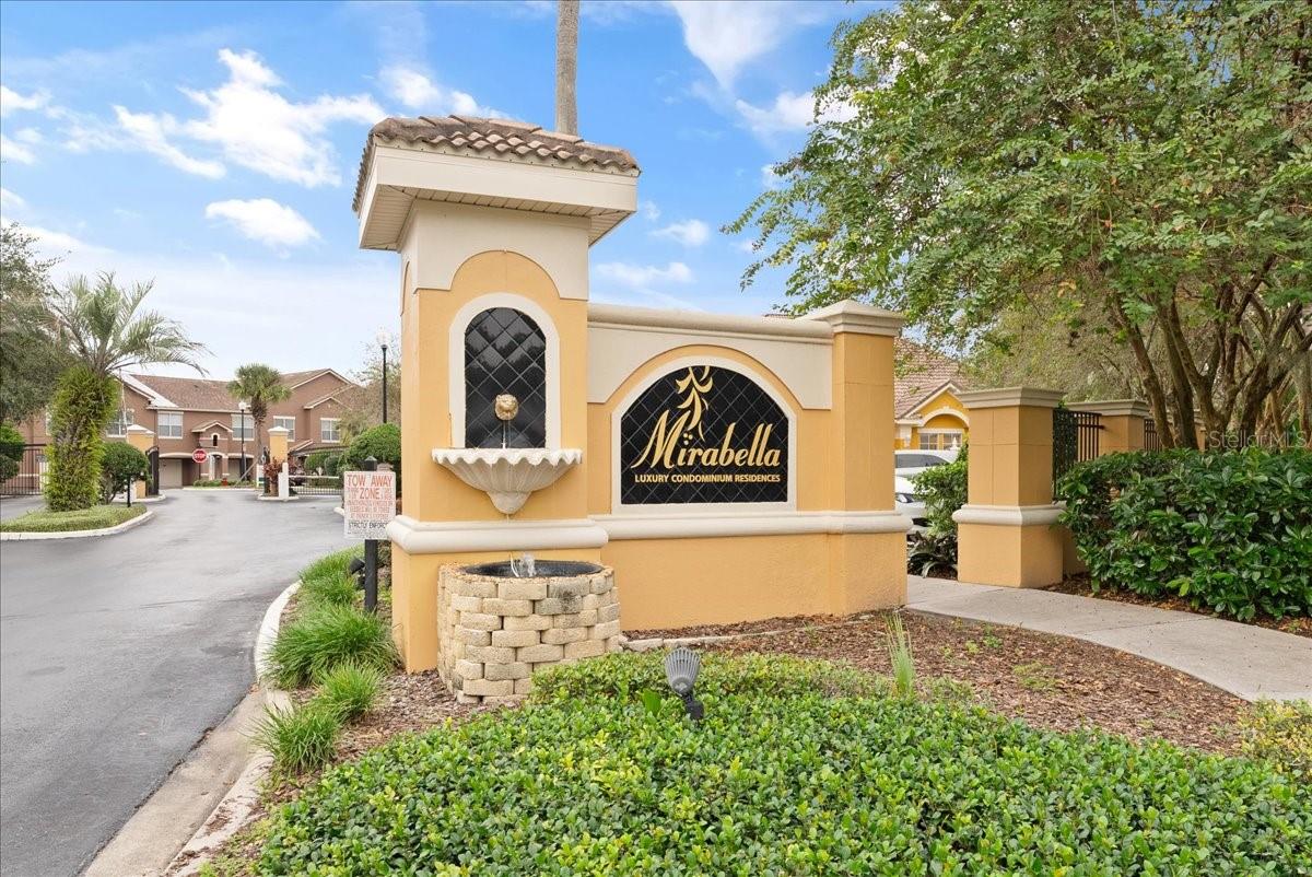 Welcome home to this one-bedroom, one-bathroom condo complete with a private, extended one-car garage, nestled in the gated community of Mirabella, just a stone's throw away from the magical world of Disney. The open concept living space bathed in natural light, highlighting the beautiful crown molding and the easy-to-maintain laminate wood flooring. The heart of this cozy home is the kitchen, equipped with ample storage and a breakfast bar that seamlessly integrates with the dining and family room, perfect for gatherings and everyday living. The primary bedroom is a personal retreat, complete with a convenient built-in desk space and a walk-in closet. The bathroom that has been tastefully updated with a new vanity, flooring, and lighting. The community doesn't fall short on amenities either, featuring tile roofs that add to its charm, a community pool, volleyball court, fitness center, car wash area, and a picturesque picnic and BBQ area beside a tranquil pond with a fountain. Ideally situated minutes from Disney this condo is perfect for Disney Cast Members or anyone who desires to be close to the magic. Whether you're a Cast Member, starting a new chapter, seeking a vacation home, or investing in a rental property, this condo perfectly blends convenience, comfort, and community. Schedule your private showing today!
