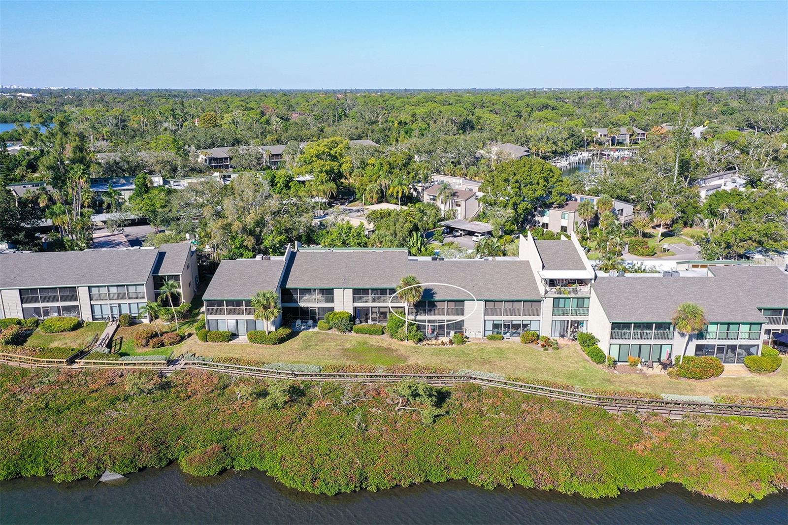 Discover one of Sarasota’s most desirable waterfront condos! It’s in great shape, with no hurricane damage. This stunning second-floor condo in Pelican Cove offers breathtaking views of Little Sarasota Bay. Imagine floor-to-ceiling glass sliders in the living room and main bedroom, along with electronic Hunter Douglas blinds, a new laundry area, and two refreshed bathrooms. Plus, you’ll have plenty of closet space and a separate, locked storage area in the carport, perfect for golf bags and at least two bikes. The kitchen has also been updated with contemporary cabinets, marble countertops, and stainless steel European Smeg appliances. The living areas feature beautiful travertine floor tiles, and the bedrooms have newer carpet. You’ll also find a new A/C system and a new hot water tank. This special home is located west of the trail but just a few minutes away, giving you easy access to all the shopping, dining, and exploring Sarasota has to offer.
About Pelican Cove: It’s a lovely marina with six heated pools, a hot tub, an exercise room, tennis and pickleball courts, and clubs. You’ll love kayaking and biking here! Pelican Cove is a tropical paradise in Sarasota, a nature lover’s dream! You’ll find beautiful and expansive walking paths on exquisite grounds. Pelican Cove is also a nature conservancy and a bird sanctuary. And the view from this condo, across Little Sarasota Bay, includes a host of bird rookery islands. You can even take classes at Pelican Cove University or in yoga, tai chi, water aerobics, painting, or photography. There are over 37 clubs for photography, fiber arts, cycling, culinary arts, bridge, film, and more. Or, simply relax at the evening jazz and classical music concerts, including those held on the harbor. Located on the lush grounds of the former Wilbanks Estate, Pelican Cove is hidden away yet just minutes from everything! Come see for yourself—this is the lifestyle you deserve! Recent updates include a new refrigerator, hot water heater, laundry closet, storm and exterior door, electrical panel, and a new kitchen window.