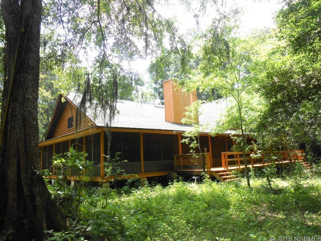 TURNKEY FURNISHED FULL LOG HOME SITS ON 10.72 ACRES OF PRIVATE, SECLUDED, FENCED, WOODED COUNTRY OASIS. 3300 SQ FT UNDER AIR FEATURES 18X25 MSTR BDR WITH WOODBURNING FIREPLACE. 2 OTHER BDR WITH 2 FULL BATHS DOWN. 30X20 GREAT ROOM WITH HARDWOOD FLOORS AND EXPOSED BEAMS, VAULTED CEILINGS AND WOODBURNING FIREPLACE. FULL LOG INTERIOR, NO DRYWALL. 2 LG LOFTS UPSTAIRS 1 WITH SPIRAL STARICASE. LOFTS CAN BE CONVERTED TO MAKE 5 BEDROOMS. KITCHEN W/GRANITE. 45X70 FULLY SCREENED WRAP ALL THE WAY AROUND PORCH. NEWER ROOF AND A/C. HORSES PERMITTED AND TERMITE BOND. COUNTRY LIVING AT ITS BEST.