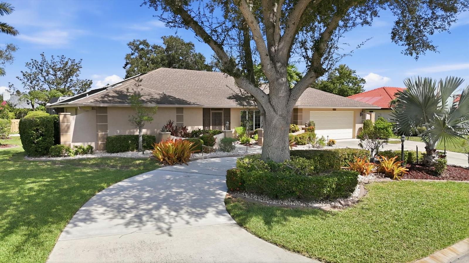 Opportunity awaits in the highly desirable Country Lakes neighborhood of Palm Aire. This 3-bedroom, 2-bathroom pool home is situated on a large, tropically landscaped lot and features a highly functional split-bedroom floor plan. With great bones and classic architectural features, this residence is clean, comfortable, and ready for a buyer looking to infuse their own personal style and updates over time.

The exterior offers excellent curb appeal with a circular driveway and a distinct wrought iron entryway. Inside, the foyer opens to a formal living and dining area highlighted by vaulted ceilings with exposed wood beams. Fully retractable triple sliding doors bridge the indoor and outdoor spaces, filling the home with natural light. 

The open-concept eat-in kitchen and family room serve as the central hub of the home, featuring a brick feature wall with built-in shelving and a convenient pass-through bar window to the lanai.

The primary suite offers a private retreat with a double-retractable slider to the pool, a spacious walk-in closet, and an ensuite bath with a tub and separate shower. Two additional guest bedrooms feature large closets and share a hallway bath. This guest bathroom includes a walk-in shower and direct access to the lanai, serving as a highly convenient pool bath.

Outdoor living is a breeze on the expansive covered lanai, which features three ceiling fans and overlooks a sparkling blue pool with child-safety fencing. The backyard beyond the pool area is fully fenced and landscaped for privacy. Practical features include a large laundry room with a sink and cabinetry, and a 2-car garage with epoxy flooring, storage cabinets, and a dedicated side door for golf cart parking. Key mechanical updates include a new HVAC in 2019 and a water heater in 2017 (roof 2005). Bring your design ideas and make this solid Palm Aire home your own.  

Various levels of optional membership available at Palm Aire Country Club.