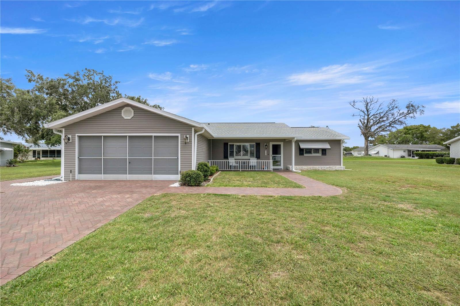 Welcome to this beautifully maintained 2 bedroom, 2 bath home in the highly desirable 55+ community of Spruce Creek South. This move in ready home offers a bright and inviting floor plan with spacious living areas, a well appointed kitchen, and generously sized bedrooms designed for comfortable everyday living.

You'll have peace of mind knowing the major updates have already been completed, including a new roof in 2025, a new septic system and leach field in 2025, all new siding in 2022, a 2020 HVAC system, a 2019 hot water heater, all new ductwork, and a whole house self cleaning water softener. The home also features a brick veneer driveway adding great curb appeal.

Enjoy relaxing on the screened lanai while taking in the peaceful surroundings, or take advantage of everything Spruce Creek South has to provide. Community amenities include an 18 hole golf course, an on site restaurant, clubhouse, fitness center, swimming pool, and a full calendar of social activities.

Conveniently located just minutes from shopping, dining, medical facilities, and The Villages, this home offers the perfect combination of comfort, convenience, and low maintenance living. With so many major improvements already completed, all that's left to do is move in and enjoy the Florida lifestyle.