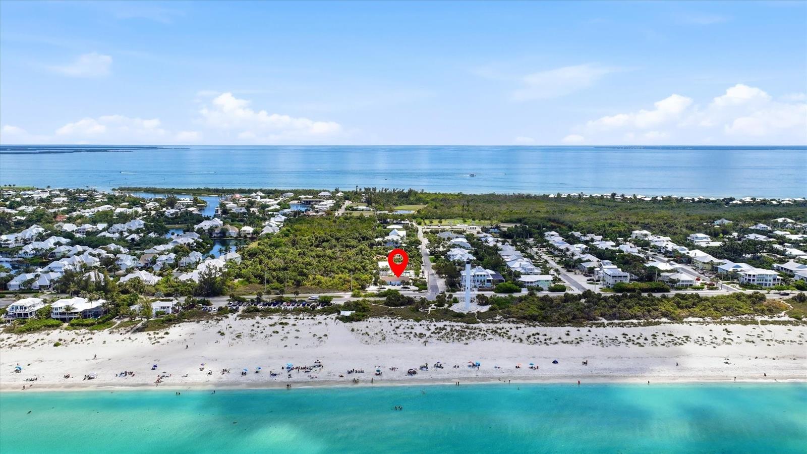 Exceptional redevelopment opportunity in one of Boca Grande’s most iconic settings. This 0.39-acre parcel is uniquely positioned with a state-owned corridor along the north boundary, adds privacy, openness, and light. To the west, enjoy a stable Gulf view corridor and the prominent presence of the iconic Gasparilla Island Lighthouse, creating a rare combination of scenery and identity. The existing duplex provides immediate use or rental income while planning your future luxury build. Few properties offer this blend of conservation adjacency, view protection, and landmark proximity—a scarce offering for buyers seeking a signature Gulfside homesite in a legacy location.