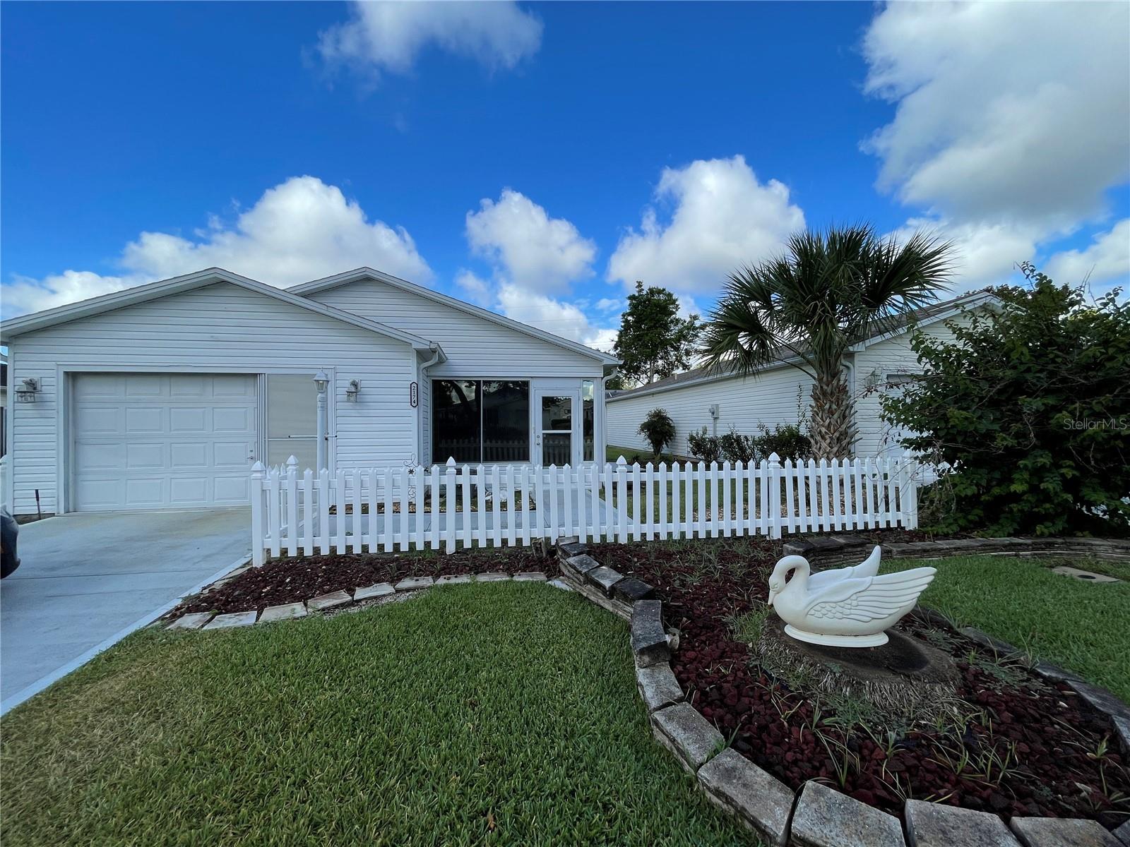 Attention golfers!!!   This beautiful 2 bedroom, 2 full bathroom, extended one car garage is conveniently located in the Villages of Santo Domingo.  This unfurnished long term rental home comes with laminate floors, stainless steel appliances, plantation shutters, freshly painted.
It is located 2.9 miles from Spanish Springs Town Square, 4.4 miles from Lake Sumter Landing, 1.5 miles from Hacienda Hills Golf & Country Club, 4.4 miles from Lake Sumter Landing, 2.2 miles from Glenview Country Club, 1.8 miles from Savannah Center, to mention a few.
Long term only.