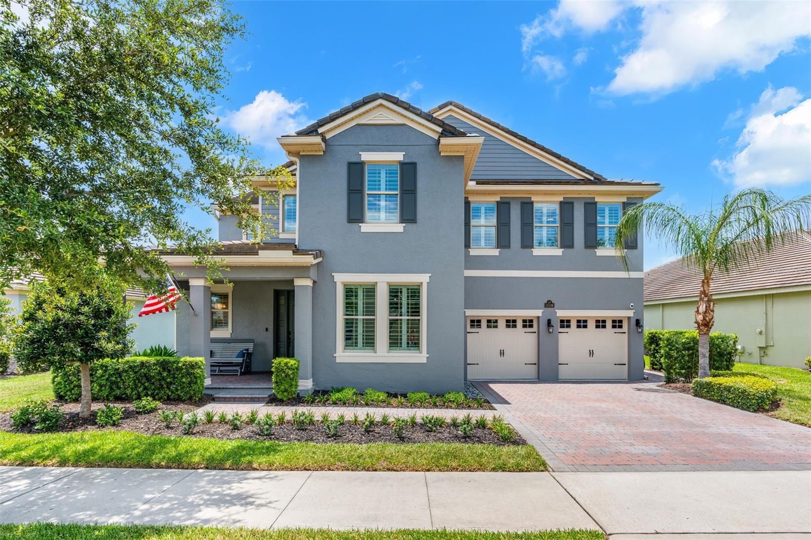Stunning lakefront living in the heart of Waterleigh! This 5 bedroom, 3 and a half bathroom home offers an open concept downstairs living space, a dedicated home office, and custom plantation shutters throughout. The primary suite is on the first floor providing lake views and a door to the screened in patio. Relax on the screened in patio with serene lake views, or enjoy the beautifully updated upstairs bathrooms featuring solid quartz slab walk in showers with low profile quartz bases. Additional upgrades include a whole home LifeSource water filtration system and an energy efficient AC/heat pump in the garage. Enjoy resort style amenities including 4 community pools, pickleball and tennis courts, mini golf, sand volleyball, and multiple playgrounds. Zoned for top Horizon West schools, with easy access to shopping, grocery, and Disney. Lakefront views, luxury updates, and an unbeatable location. This one has it all!