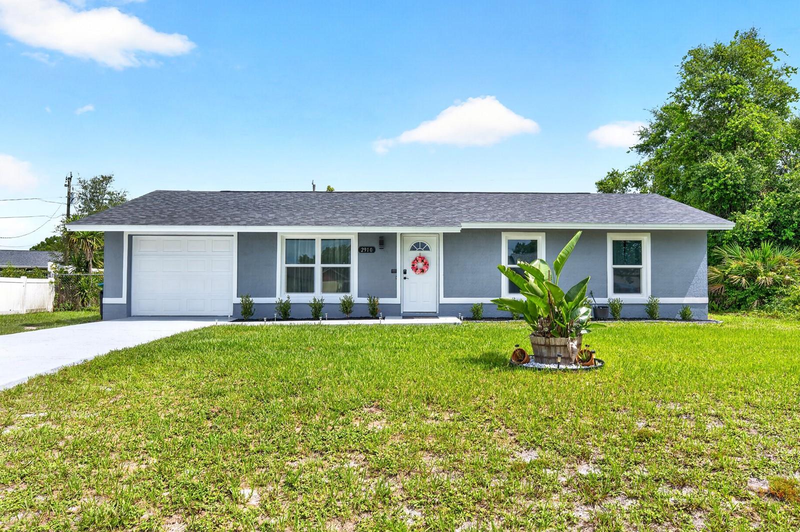 ~Seller may consider buyer concessions if made in an offer~Move right into this BEAUTIFULLY UPDATED 2-bedroom, 1-bath home in Deltona Lakes, where major improvements have already been completed for you. With NO HOA, outstanding curb appeal, and an EXPANSIVE FENCED BACKYARD, this home brings the perfect combination of comfort, convenience, and freedom. From the moment you arrive, you'll appreciate the impressive list of RECENT UPDATES, including FRESH EXTERIOR PAINT (2026), a NEW ROOF (2026), NEW WINDOWS (2026), NEW FRONT DOOR (2026), NEW GARAGE DOOR (2026), NEW DRIVEWAY AND WALKWAY (2026), and all-NEW LANDSCAPING (2026), creating a fresh and welcoming first impression. Step inside to discover a spacious Living Room filled with NATURAL LIGHT, creating a bright and inviting atmosphere. EASY-CARE TILE FLOORING flows throughout the home, while the Dining Area features a large window overlooking the EXPANSIVE BACKYARD, bringing the outdoors in. Adjacent to the Dining Area, the Kitchen offers both style and functionality with stainless steel appliances, including a BRAND-NEW DISHWASHER, stone countertops, and a convenient closet pantry. As you proceed down the hallway, you'll find a useful STORAGE CLOSET along with TWO GENEROUSLY-SIZED BEDROOMS. The Primary Bedroom features DUAL CLOSETS and ADDITIONAL SPACE perfect for a reading nook, sitting area, or workspace, creating a versatile and comfortable retreat. The second Bedroom is equally spacious and boasts two closets of its own, including a WALK-IN CLOSET. The stylish Bathroom was TASTEFULLY UPDATED in 2023, while additional improvements include a NEW WATER HEATER (2021) and WATER SOFTENER (2019). Step outside and enjoy the NEWLY ADDED BACK PATIO (2026) overlooking the LARGE FENCED BACKYARD. Whether you envision gardening, entertaining, creating a play area, or simply enjoying the extra outdoor space, the possibilities are endless. An added bonus for qualified buyers is the opportunity to take advantage of an ASSUMABLE LOAN, offering potential financing benefits. Conveniently located in Deltona Lakes, this home is JUST MINUTES from OUTDOOR RECREATION at Lake Monroe, Thornby Park, Green Springs Park, and the scenic trails of the Spring-to-Spring Trail. Nearby shopping, dining, and entertainment options are plentiful, while EASY ACCESS to I-4 makes commuting to Orlando, Daytona Beach, New Smyrna Beach, and Central Florida's many attractions convenient and accessible. With EXTENSIVE RECENT UPDATES, spacious living areas, a large fenced yard, and the freedom of NO HOA living, this MOVE-IN READY Deltona Lakes home is an exceptional opportunity you won't want to miss. Make this home yours before it's gone!