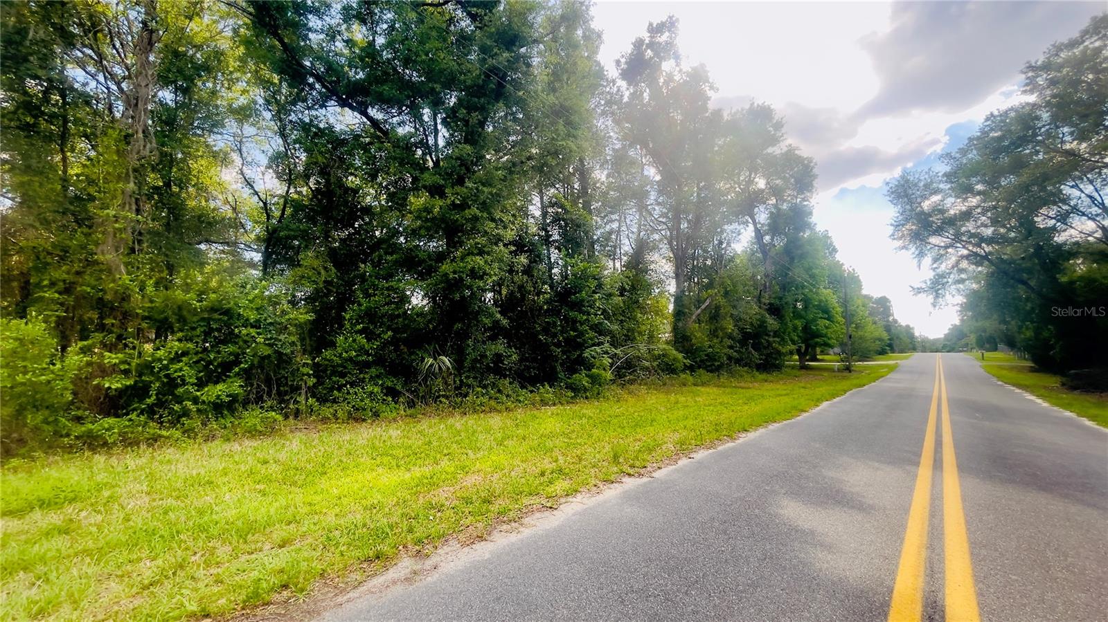 .34-acre corner lot located on a paved street, offering a convenient setting for a site-built or manufactured home just minutes from town. Need more space? Two adjoining lots are also available, providing an additional.48 acres for a total of approximately .82 acres. Explore the possibilities and secure the space that fits your needs.