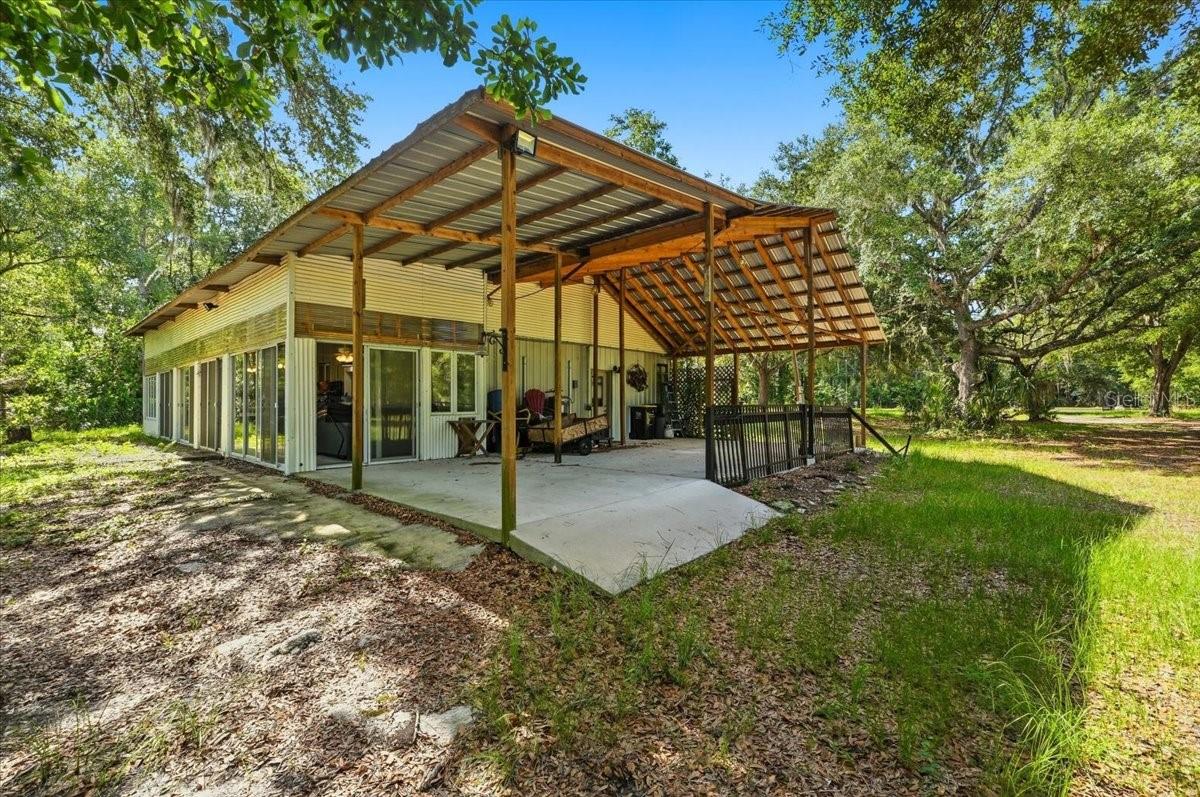 Welcome to your own private country retreat! Situated on 5 beautiful acres, this unique horse property offers the perfect blend of rural charm, functionality, and modern convenience. Tucked away on a paved dead-end road, you’ll enjoy added privacy, minimal traffic, and a peaceful country setting.

The well-maintained barndominium features 2 bedrooms, 1 bathroom, a spacious sunroom filled with natural light, and an attached workshop ideal for hobbies, storage, or projects.

Relax and enjoy peaceful Florida sunsets from the large covered front porch overlooking the property. An impressive iron-gated entrance provides privacy and security while creating a grand first impression. The fully usable acreage offers plenty of room for horses, livestock, gardening, recreational vehicles, or future expansion.

Additional features include RV hookups, making it perfect for guests, travelers, or additional income opportunities. Nature lovers will appreciate being approximately 10 to 15 minutes from a state park and nearby nature preserve, offering endless opportunities for hiking, horseback riding, wildlife viewing, and outdoor recreation. Despite its peaceful rural setting, the property is conveniently located just 5 to 10 minutes from shopping, dining, medical facilities, and I-4, providing easy access to everyday necessities and commuting routes.

Whether you’re seeking a horse farm, country homestead, weekend retreat, or a place to enjoy wide-open spaces, this property offers endless possibilities. Enjoy the rare combination of acreage, functionality, privacy, and convenience all in one exceptional property.

The sunroom measures 12x80 and the covered porch measures 20x37

Schedule your private showing today and experience the freedom of country living without sacrificing access to modern amenities.