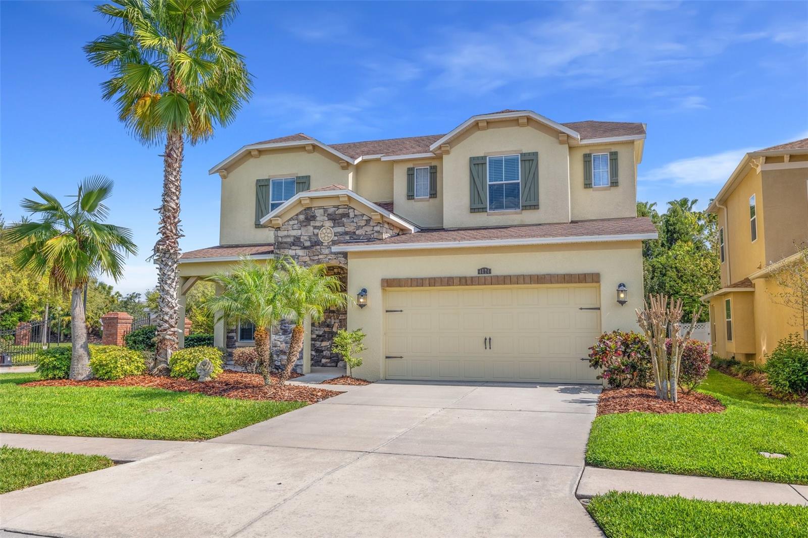 One or more photo(s) has been virtually staged. Tucked behind the gates of Bellafield within the highly sought-after Seven Oaks community of Wesley Chapel, this expansive executive-style residence offers nearly 3,500 square feet of thoughtfully designed living space with 4 bedrooms, 2.5 bathrooms, + LOFT, + ADDITIONAL OVERSIZED BONUS/MEDIA ROOM, and a functional open-concept layout designed for both elevated entertaining and everyday comfort. Loaded with upgrades within this rare floor plan, the owners have taken immaculate care of the home from top to bottom. From the moment you step inside, the home showcases soaring ceilings, abundant natural light, formal and casual living spaces, and a layout that lives much larger than expected. The gourmet kitchen serves as the centerpiece of the home, featuring an oversized center island, rich 42-inch cabinetry with crown molding, beautiful stone backsplash detail, stainless steel appliances, dual full-sized ovens, a 5-burner range, walk-in pantry, and an additional butler’s pantry seamlessly connecting the formal dining room to the kitchen and great room for effortless hosting. Sliding glass doors off the additional eat-in kitchen area create a seamless transition to the covered lanai and backyard space, embracing true indoor/outdoor Florida living. Privately positioned on the first floor, the spacious primary suite offers a true retreat with a spa-inspired en-suite bathroom complete with dual vanities, soaking tub, oversized walk-in shower, and an expansive walk-in closet. The first floor also features a dedicated laundry/mud room with direct garage access and a convenient half bath for guests. Upstairs, the home continues to impress with three additional bedrooms, a full bathroom, open loft space, and a massive bonus/media room with prewiring already in place for a home theater, game room, secondary living area, office, gym, or flex space tailored to your lifestyle. Significant updates include new HVAC systems (2024), fresh interior paint throughout (2026), and upgraded epoxy garage flooring. Beyond the home itself, residents of Seven Oaks enjoy access to resort-style amenities including a clubhouse, multiple pools, splash park, fitness center, tennis and basketball courts, playgrounds, and scenic walking trails. Conveniently located near top-rated schools, Moffitt Cancer Center, The Shops at Wiregrass, Tampa Premium Outlets, premier dining, entertainment, and major highways with direct access into Tampa, this is an exceptional opportunity to own a spacious, move-in-ready home within one of Wesley Chapel’s most established and desirable master-planned communities.
