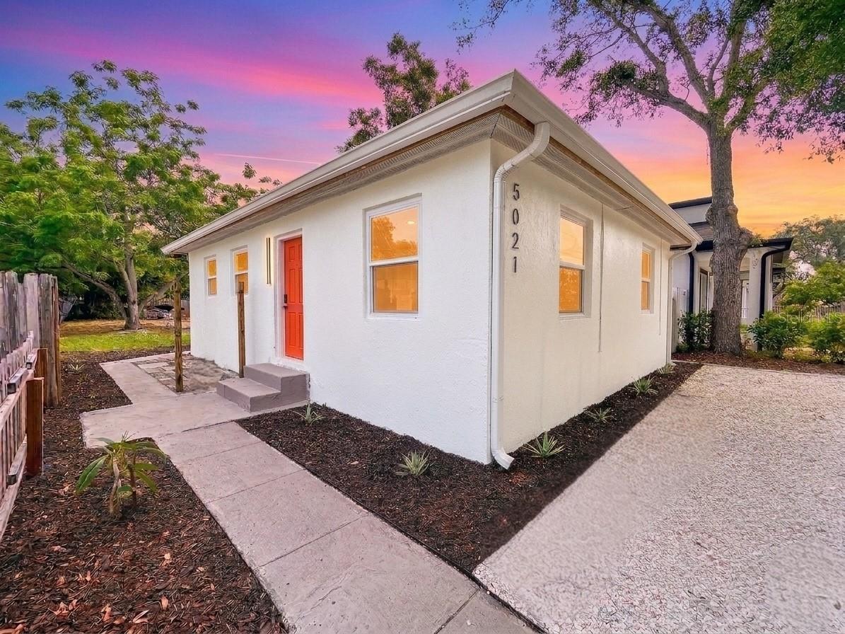 One or more photo(s) has been virtually staged. Located in vibrant Gulfport, this updated 3 bed, 1 bath home combines modern updates with coastal charm. Freshly painted inside and out and newly landscaped, this home offers great curb appeal with its xeriscape front yard accented by crisp white seashells. Inside, all new luxury vinyl and ceramic tile flooring flow through the home. The renovated kitchen features newer appliances, cabinets, and custom tile backsplash. Stylish upgrades continue in the bathroom with charcoal grey ceramic tile flooring, marble-look ceramic tile walls, and eye-catching azure blue penny tile shower flooring, adding a modern finish. This home includes a brand new Rheem HVAC (2026), updated electrical panel (2023), newer roof (2022), newer hurricane impact windows (2023), a newer tankless water heater (2023), and all new ceiling fan and light combinations with retractable blades (“fandeliers”). Step outside to a spacious backyard with new sod and rear alley access with driveway, providing plenty of potential for an ADU (accessory or secondary dwelling unit), garage addition, or large shed. Not in a flood zone nor evacuation zone, this home is just minutes from downtown Gulfport, the Warehouse Arts District, downtown St. Petersburg, the Gulf beaches, and 30 minutes from Tampa. Call to schedule your showing today!