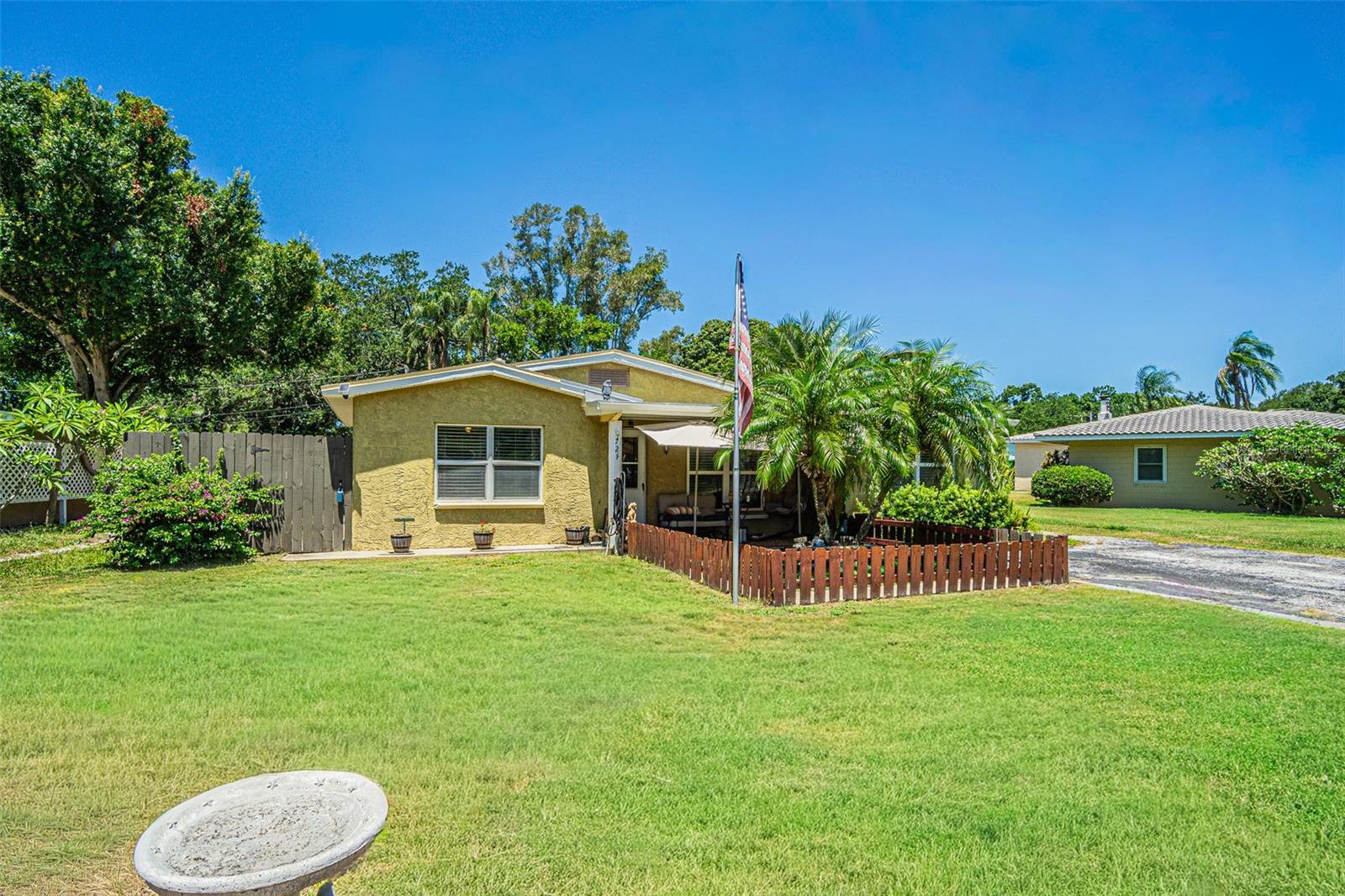 Experience all the tranquility with this gorgeous slice of heaven in the Pasadena Best Location. This unique oversized lot allows you to dream and craft your own masterpiece in both the front and backyards. This concrete block one story rancher has a  newer roof, solar system with Tesla Battery to provide continuous energy during a possible blackout which powers the entire home. It has a hot tub, paver patio with overhead cover has three (sheds) for storage. A pedestrian gate in the rear of the backyard allows another walking path through a tropical oasis. The house has upgraded floors, beautiful granite counter tops, upgraded stainless steel appliances and chair molding. A second large flex room is an option for another large bedroom, entertainment area or play room. The large front yard double wide driveway holds up to 6-8 cars comfortably. Install a RV hook up, store a large boat or build out a your favorite build out. Kick back and read a book in all the serenity Only a 6 min walk to the Mariner and gorgeous views on Boca Ciega Bay. NO CDD, HOA! Call for a private showing. Easy to show.