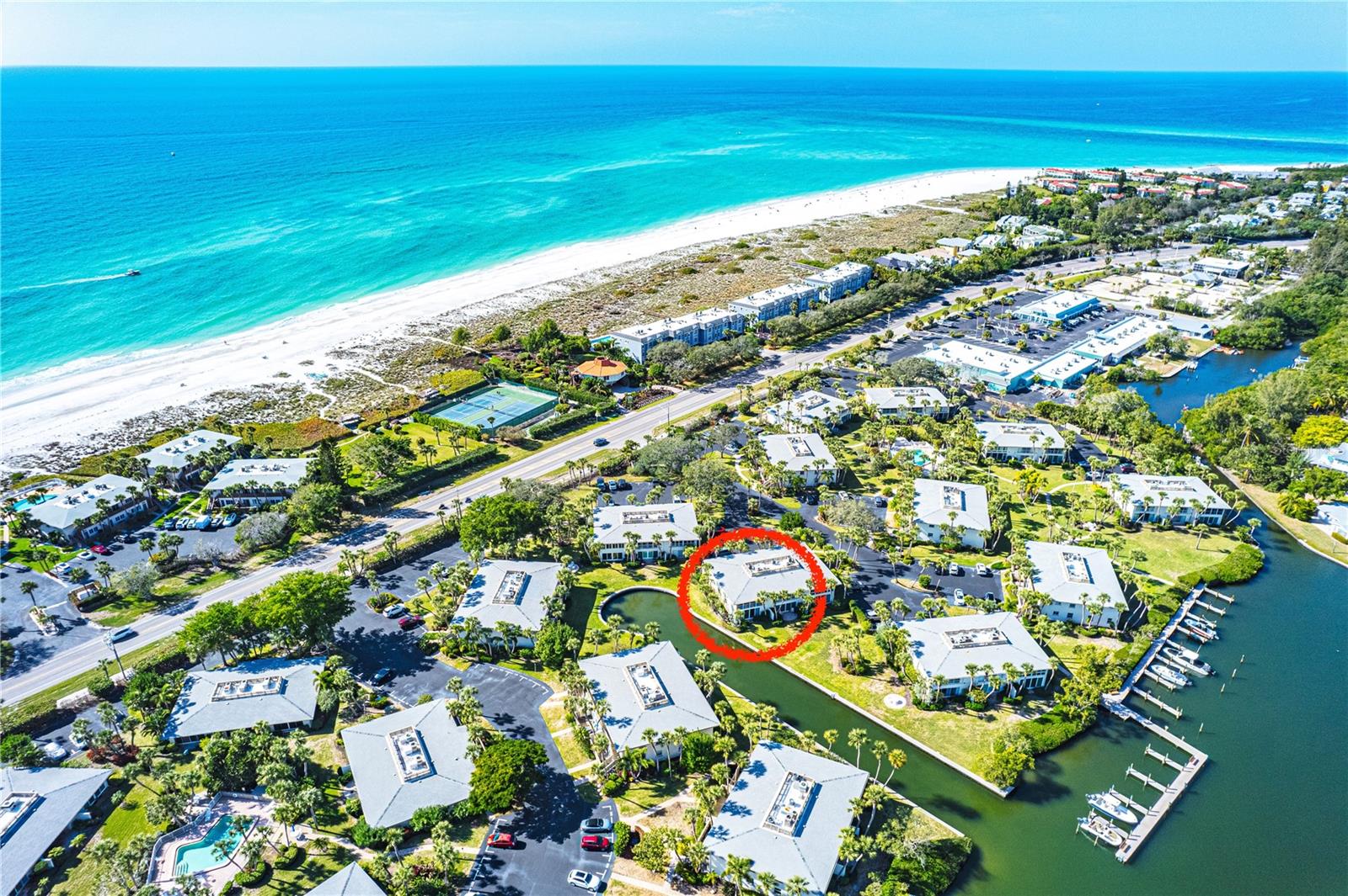 Bring your boat!!!  Excellent water views in this north end desirable Whitney Beach waterfront community.
If you’ve been waiting for the perfect second-floor residence in the highly sought-after Whitney Beach community on Longboat Key, this is the one. Offering some of the finest views in the complex, this turn-key condominium has been thoughtfully upgraded and is move-in ready.
What truly sets Whitney Beach apart is its rare combination of resort-style living and relaxed island charm:

Pet-friendly paradise — One of the few communities on Longboat Key that welcomes up to two large dogs, making it a dream for dog lovers.
Private boat docks on the protected bayou, providing easy access to the water.
One of the widest and most beautiful private beaches on the island, with direct deeded access.
Resort-style heated and cooled pools for year-round enjoyment.
Prime second-floor positioning that delivers the community’s best panoramic views.
Unforgettable wildlife moments right from your home — watch mama manatees nurturing their calves in the canal and dolphins feeding just offshore.
Convenient kayak storage and launch area.
Exceptionally walkable location — just steps from upscale restaurants, shops, and a fitness center. One of the most pedestrian-friendly communities on all of Longboat Key.
A thoughtfully designed floor plan with a low-density, intimate feel — no high-rise hotel atmosphere here.
Spacious, peaceful surroundings where residents enjoy privacy and breathing room.
Serene walking path to the iconic Beer Can Island (Greer Island), with its pristine beach and natural beauty.
Just over the bridge lies Coquina Beach, home to vibrant weekly craft fairs and farmers markets.

Nestled at the tranquil northern end of Longboat Key, this location offers the best of both worlds — easy proximity to the charming village atmosphere and world-class amenities of Anna Maria Island, one of America’s most treasured coastal gems.
Don’t miss your opportunity to own a piece of this turquoise paradise at an exceptional value. Wake up every morning in one of Florida’s most exclusive island retreats — where luxury, nature, and relaxed coastal living come together perfectly.