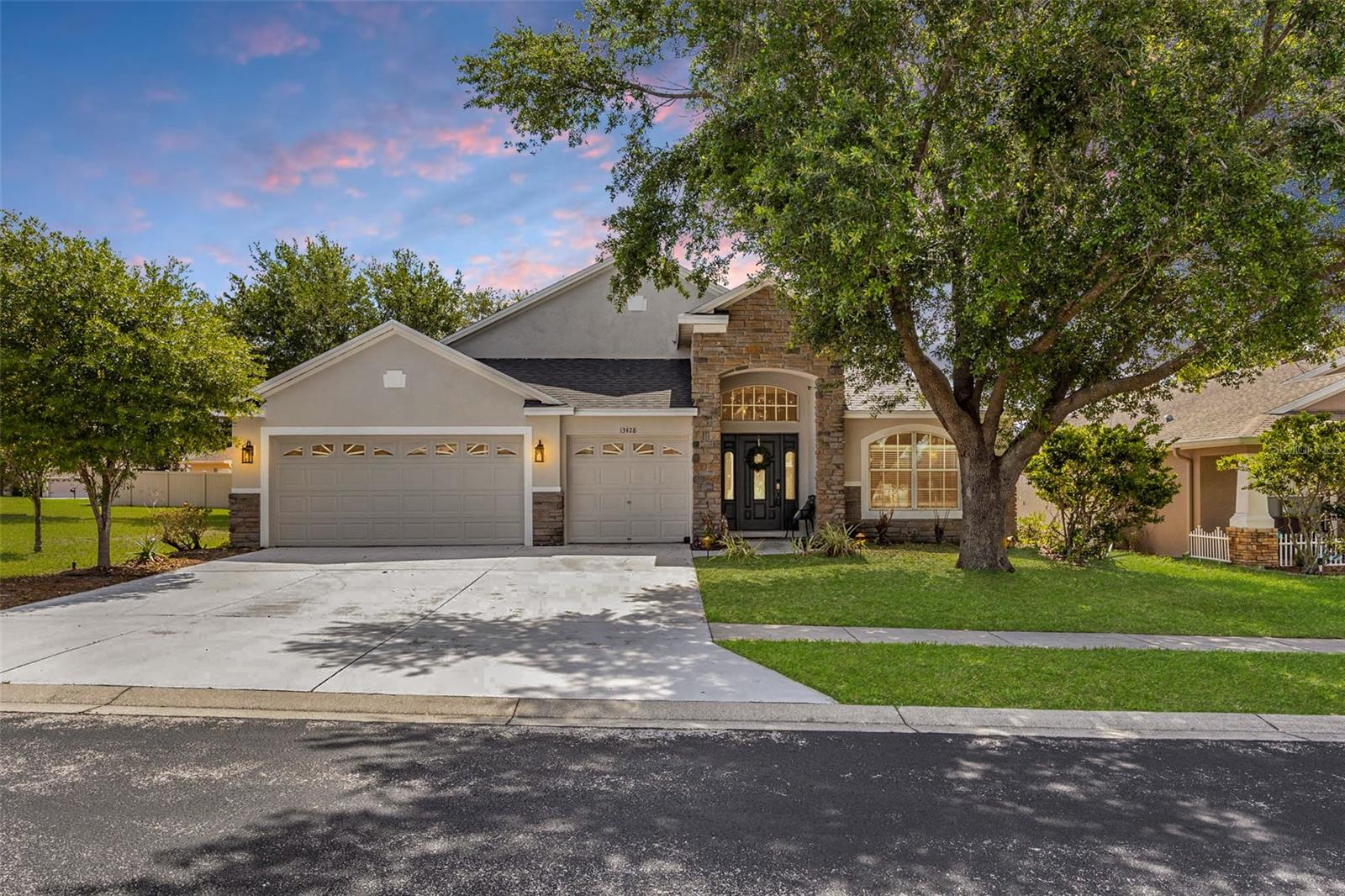 Make sure to check out the Virtual Tour for a 3D Model w/ Walkthrough, Floor Plan w/ Measurements, Video, & more! Space, style, and flexibility all wrapped into one beautifully maintained package, 13428 Mandalay Place checks boxes most homes can only dream about. Located on a spacious .31 acre corner lot inside the gated Sterling Hill community, this home offers 4 bedrooms, 3 full bathrooms, TWO oversized primary suites, a dedicated office, and a 3 car garage across 2,653 square feet of living space.  With a New Roof and AC both installed in 2023, the home also brings peace of mind to match the space and flexibility that comes with soaring ceilings, expansive living areas, and a layout designed for real life, ready for growing families, guests, or multi generational living.

Inside, the vaulted ceilings and open spaces immediately make the home feel airy and inviting. The formal living and dining areas create an impressive first impression while still feeling comfortable. The office or flex room near the front entry gives you endless possibilities including a home office, playroom, fitness room, or even a potential fifth bedroom setup. Luxury vinyl flooring throughout the main living spaces adds a clean modern look that ties everything together beautifully.

The kitchen sits at the center of the home and was built for functionality and gathering. Endless cabinetry, generous counter space, a breakfast bar, and an oversized breakfast nook flow seamlessly into the family room, creating a setup that keeps everyone connected. The family room offers plenty of room for furniture, movie nights, and entertaining.

One of the standout features is the rare dual primary suite layout. The main primary suite offers a spacious retreat with room for a sitting area, and a massive ensuite bath complete with dual vanities, garden tub, separate walk in shower, private water closet, and an oversized walk in closet. The second primary bedroom creates incredible flexibility for anyone who appreciates a little extra privacy.

The additional bedrooms are generously sized, and the thoughtful split floor plan keeps the home flowing comfortably for both everyday living and entertaining. Even the laundry room and garage spaces feel oversized and practical, giving you storage space that actually makes a difference.

Step outside and the Florida lifestyle fully kicks in. The oversized screened lanai and expansive paver patio create the perfect setup for outdoor dining, relaxing evenings, and backyard gatherings beneath the mature shade trees. The fully fenced backyard offers privacy, room for pets to roam, and direct access to a pool bath already in place if adding a future pool is on the wish list. The corner lot adds extra curb appeal, while the oversized 3 car garage leaves plenty of room for vehicles, storage, and golf carts.

Sterling Hills offers gated access, resort style pools, fitness centers, playgrounds, splash pad, tennis courts, basketball courts, walking trails, volleyball courts, and a huge dog park. The Suncoast Parkway is approximately 15 minutes away for an easy Tampa commute, US 19 is around 20 minutes away, and Weeki Wachee Springs State Park is roughly 15 minutes from home. While shopping, dining, grocery stores, and golf courses are all nearby.

Homes with this much space, flexibility, and functionality are hard to come by. Schedule your private showing before someone else decides this is exactly where their next chapter belongs.