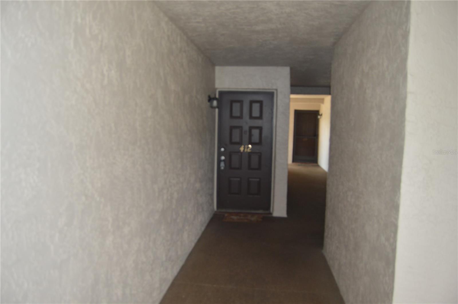 Location, location, location. This rare three-bedroom, two-bath condo offers effortless living with tile throughout the main areas and laminate in all bedrooms. The primary suite features an en-suite bath with shower and a walk-in closet. An open living/dining area flows to a screened, tiled lanai through double sliding glass doors—ideal for morning coffee, plants, or relaxed entertaining. The kitchen boasts granite countertops, generous prep space, and plentiful cabinetry. Enjoy community amenities with views of the tennis courts and convenient access to the pool and clubhouse. System updates include interior AC (2020), roof-mounted unit (2018), and water heater (2021). Prime convenience near Countryside Mall for shopping, dining, and movies, and minutes to Honeymoon Island State Park and Clearwater Beach. Three-bedroom condos are seldom available—see it soon.