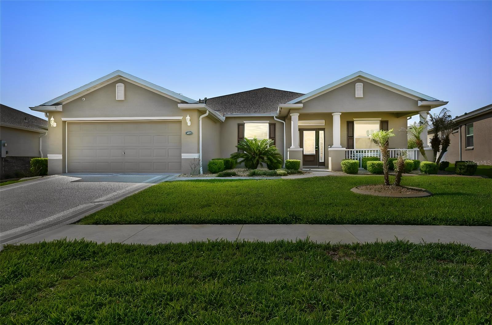 Price reduced and sellers are motivated! Welcome to this beautifully maintained Oleander model in Arlington Ridge, a guard-gated 55+ golf community just minutes from The Villages. This 4 bedroom, 3 bathroom home with a den/office has so much to offer, including a brand-new roof in January 2026, BOND PAID, and a whole-house natural gas Generac generator. Inside, you’ll find a bright and open floor plan with 9-foot ceilings, rounded corners, beautiful laminate flooring, ceramic tile in the wet areas, and plenty of room to relax, entertain, and enjoy everyday living. The kitchen is warm and inviting with granite countertops, a large island, stainless steel appliances, gas range, soft-close cabinetry, pull-outs in the lower cabinets, under-cabinet lighting, a closet pantry, breakfast nook, and a solar tube that brings in natural light. There is also a separate formal dining area, spacious living room, and indoor laundry room with washer and dryer included. The split-bedroom layout gives everyone a little extra privacy. The primary suite features dual sinks, a large walk-in closet, and a walk-in/roll-in Roman shower. One guest bedroom has its own full bath with a newer step-in shower, while the additional guest bedrooms share a third bathroom with a tub/shower combination. The den/office has pocket doors, making it a great space for working from home, hobbies, or a quiet sitting room.
Enjoy your morning coffee on the covered front porch or spend time relaxing on the screened rear lanai with an electric storm screen that can also be used for added privacy. The home also features a painted driveway and walkway, low-maintenance stucco exterior, and a 2-car garage with attic access. Arlington Ridge offers a wonderful resort-style lifestyle with golf, dining, fitness, tennis, pickleball, pools, spa/hot tub, billiards, crafts, library, movie theater, reception hall, restaurant, and pub. The community is golf cart friendly, so you can ride from home to the clubhouse and amenities. HOA includes exterior painting, lawn care, landscaping, irrigation, cable TV, high-speed internet, and Wi-Fi.
Conveniently located near shopping, dining, medical services, grocery stores, banks, pharmacies, and just a short drive to The Villages.