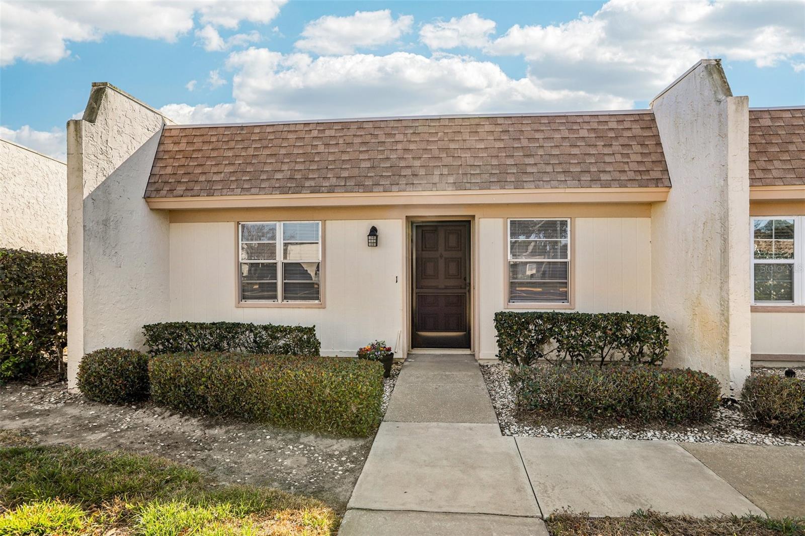 Welcome home to this beautifully renovated 2-bedroom, 1.5-bath condo in the highly sought-after 55+ Timber Oaks community of Port Richey. Offering 882 square feet of thoughtfully designed living space, this light-filled home features a desirable great room style floorplan ideal for comfortable Florida living.

Enjoy tranquil pond and bird views from almost every room, providing a peaceful, nature-filled backdrop. The condo has been completely updated with new LVP flooring, fresh interior paint, and all-new fixtures throughout. The stunning kitchen showcases brand-new cabinets, granite countertops, and all-new stainless-steel appliances. Both bathrooms have been refreshed with new toilets, new vanities, and updated towel racks and bars, offering a clean, modern feel.

Timber Oaks is an active and welcoming community featuring a clubhouse, heated pool, hot tub, exercise room, game room, tennis courts, shuffleboard, and a full calendar of social activities. HOA fees include water, cable, and internet, adding exceptional value and convenience.  Additional features include outside storage and personal carport parking.

Move-in ready and beautifully updated, this condo is perfect as a full-time residence or seasonal retreat.  Come enjoy the relaxed, social lifestyle Timber Oaks is known for.