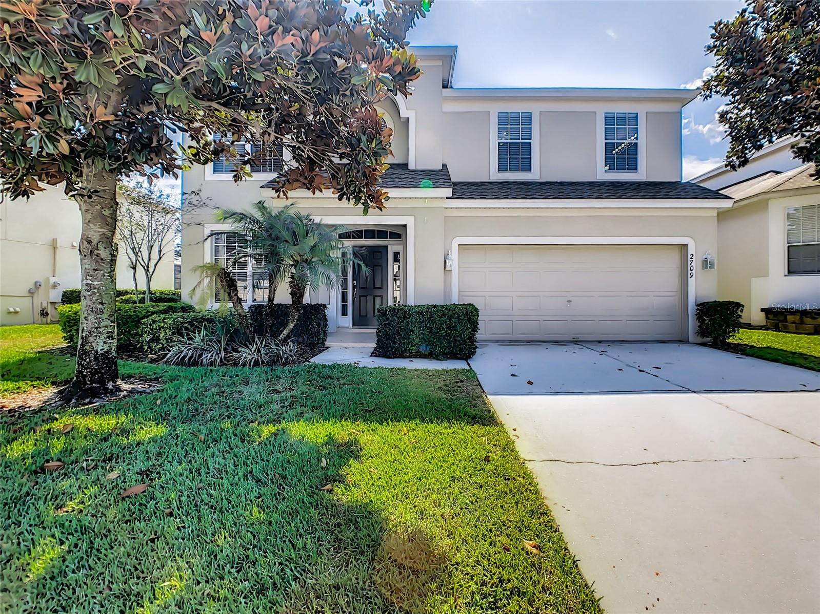 Welcome to your own piece of the magic! Located in the highly sought-after Windsor Hills Resort, just 3 miles from Disney, this fully furnished 6-bedroom vacation home offers the perfect combination of comfort, entertainment, and investment potential. Designed with guests in mind, the home features three spacious primary suites, a fully equipped kitchen, multiple gathering spaces, and plenty of room for large families or vacation groups. One of the highlights is the fun-filled Mickey Mouse-themed bunk room with a private play area, creating unforgettable memories for younger guests. Entertainment options are everywhere throughout the home, including a private home theater with theater seating, a game room featuring an arcade machine and foosball table, a billiards area, and a spacious living room perfect for relaxing after a day at the parks. Step outside to your own private oasis with a screened-in pool and spa, where you can enjoy peaceful views and added privacy thanks to no rear neighbors. Whether you're enjoying your morning coffee or winding down in the evening, the scenic backdrop creates the perfect Florida retreat. Recent updates include luxury vinyl plank flooring throughout the entire home with no carpet, providing a modern look, easy maintenance, and added durability for vacation rental use. Windsor Hills is one of Central Florida's premier vacation resort communities, offering a 24-hour guard-gated entrance and world-class amenities. Residents and guests enjoy a resort-style water park with slides, splash features, zero-entry pool and spa, a clubhouse with movie theater, fitness center, arcade, game room, sundry shop, tennis courts, basketball courts, volleyball court, putting green, and multiple playgrounds. Whether you're looking for a vacation getaway, a short-term rental investment, or both, this home offers an incredible opportunity in one of the closest resort communities to Disney. Schedule your private showing today and see why Windsor Hills remains one of the most desirable vacation destinations in Central Florida.