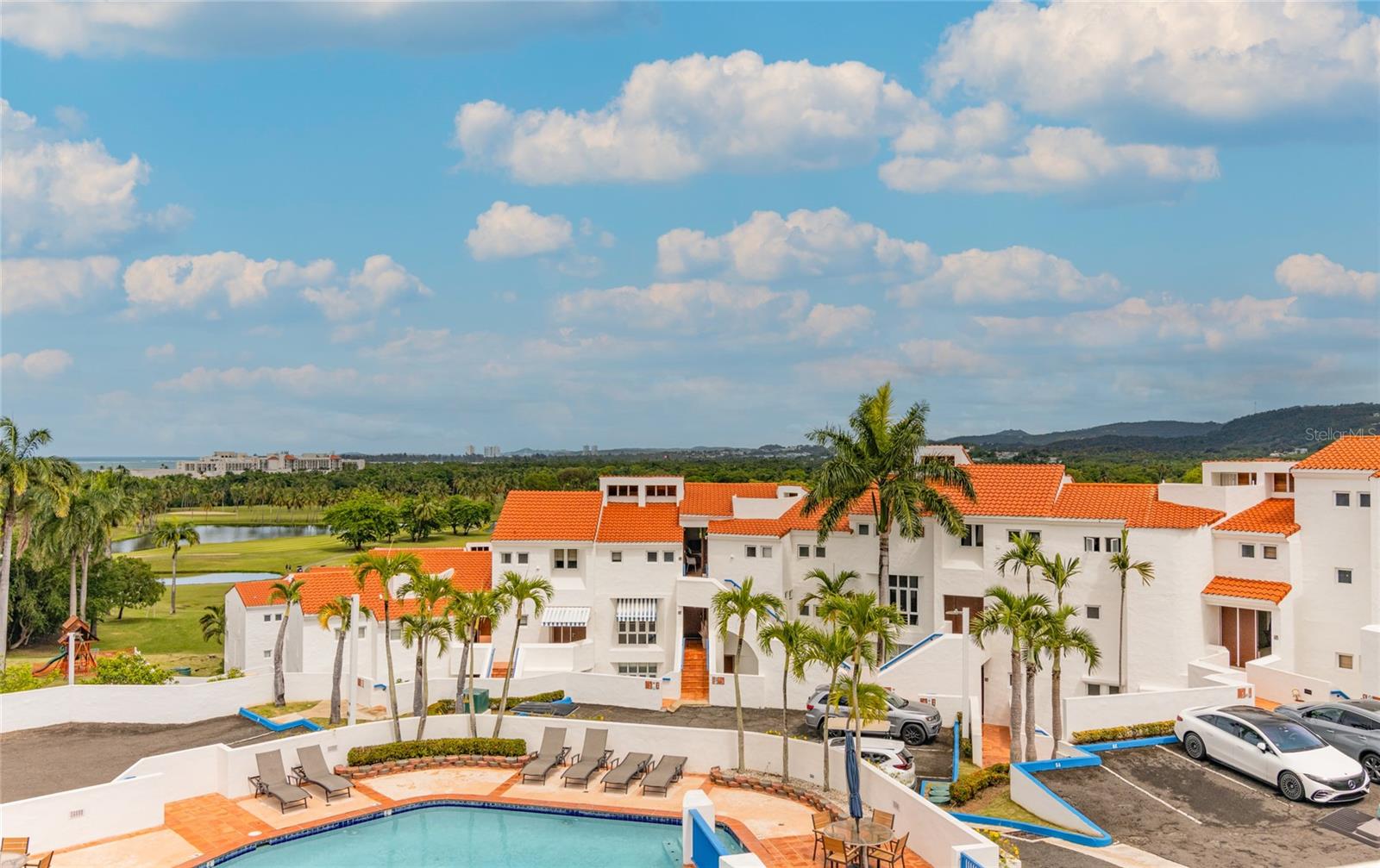 This remodeled three-bedroom, four-bathroom villa at Villa Las Brisas (Cluster IV) offers one of the most desirable layouts in the community — fully furnished, move-in ready, and overlooking the resort grounds and surrounding villas. Cluster IV permits short-term rentals, and the villa’s layout comfortably accommodates up to 12–14 guests — a rare capacity within the community.
The social areas flow with intention: an open-concept living, dining, and kitchen space that extends to a generous balcony where the tropical setting and resort surroundings take center stage. Bedrooms are privately situated on the lower level, creating a natural separation between living and resting spaces that owners and guests alike appreciate.
Ownership at Wyndham Grand Río Mar places you inside one of Puerto Rico’s most complete resort experiences — two championship golf courses (Ocean & River), tennis courts, world-class dining, a casino, lagoon-style pools, and direct beach access. Optional memberships are available to further enhance your resort lifestyle.
Located in Río Grande, minutes from El Yunque National Forest, this villa delivers something increasingly rare on the island’s northeastern coast: a fully remodeled, resort-caliber property genuinely ready for life as you want to live it. Price is negotiable — contact us to discuss terms.