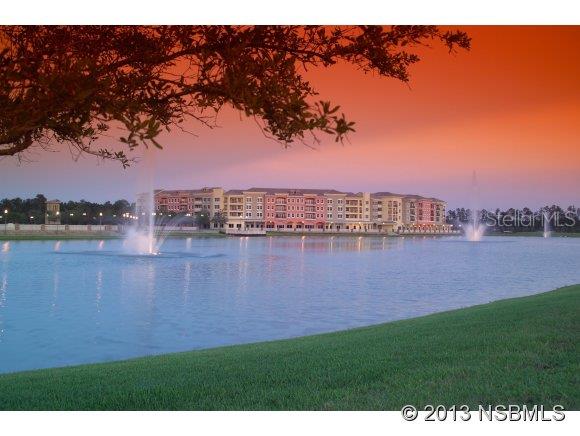 The view is spectacular on this 4th floor unit, overlooking the 4 acre lake in beautiful Venetian Bay. Fashionable decor (not included in the price but all furnishings are negotiable)Split bedroom plan. Features include wet bar in Living Room, Laundry Room. Both Bedrooms have walk-in closets. Additional secured storage next to unit. 1 Car Garage with apron for add. parking deeded with unit. Perfect for the Snow Birds or permanent residents that fall in LOVE with New Smyrna Beach. ;Water: City