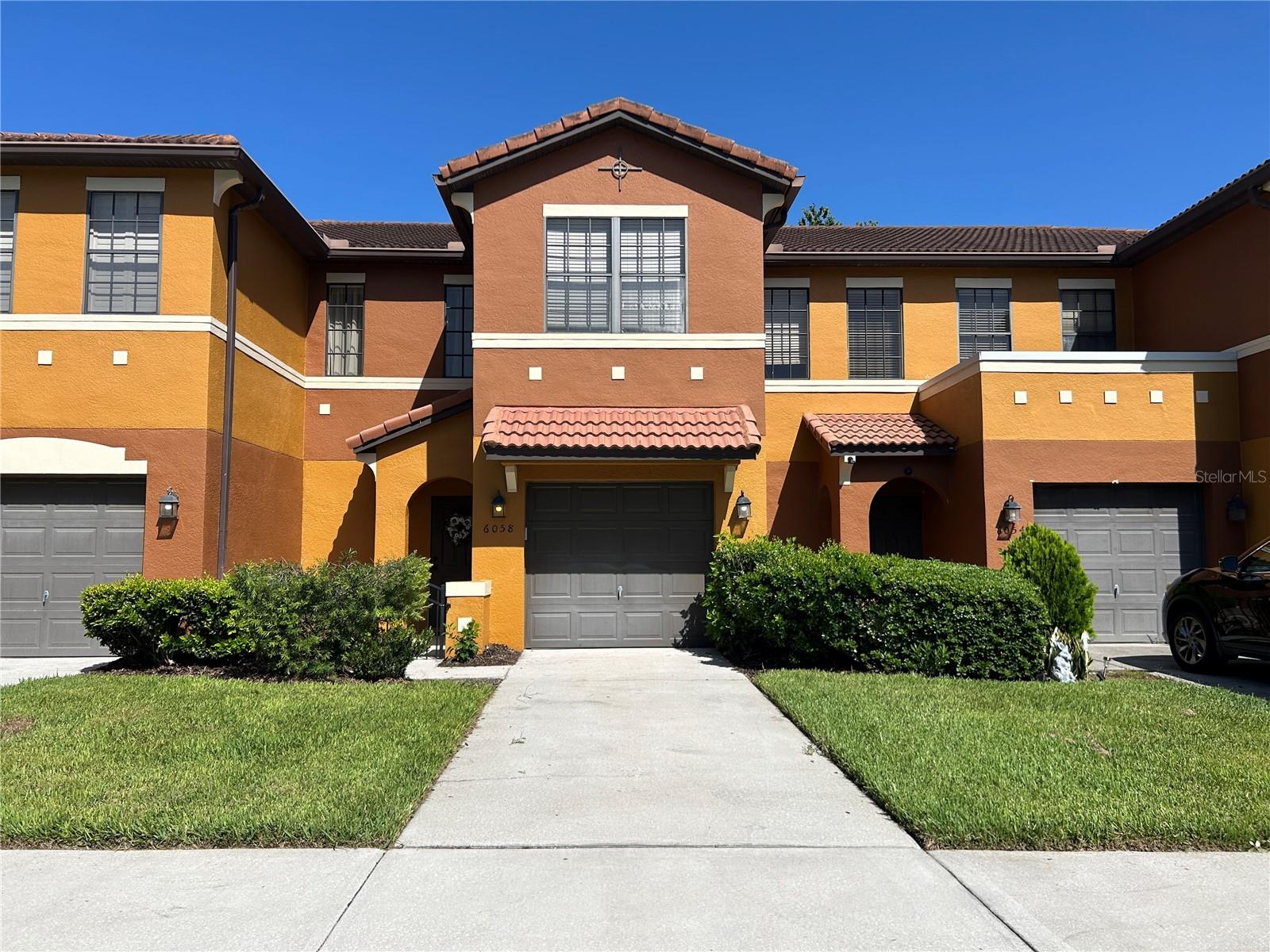Welcome to 6058 Tivoli Gardens Boulevard, a beautifully maintained 3-bedroom, 2.5-bath townhome ideally positioned on one of the most desirable lots in the community. Enjoy tranquil pond views from the front of the home and a private wooded backdrop from the rear, creating a unique combination of openness and privacy.

The spacious floorplan features engineered hardwood flooring throughout the main living areas and staircase, with laminate flooring throughout the second floor. The kitchen is equipped with Corian countertops, stainless steel appliances, ample cabinetry, and a functional layout that opens seamlessly to the dining and living areas. Additional recent improvements include a new water heater (2026), interior repaint (2023), and updated kitchen appliances (2023), offering added value and peace of mind.

Step outside to the extended screened lanai, the perfect place to relax, entertain, or enjoy your morning coffee while overlooking the peaceful wooded setting with no rear neighbors. Upstairs, the two secondary bedrooms enjoy private wooded views, while the spacious primary suite overlooks the front of the community and pond area.

Located within a gated community, residents enjoy access to a community pool, playground, and beautifully maintained grounds. Conveniently situated with easy access to Orlando International Airport, SR-417, and SR-528, this home offers an ideal blend of privacy, convenience, and low-maintenance living. The washer and dryer are also included, making your move even easier.

With pond views in the front, wooded privacy in the rear, an extended screened lanai, and thoughtful interior upgrades throughout, this move-in-ready home is a standout opportunity in Tivoli Gardens.