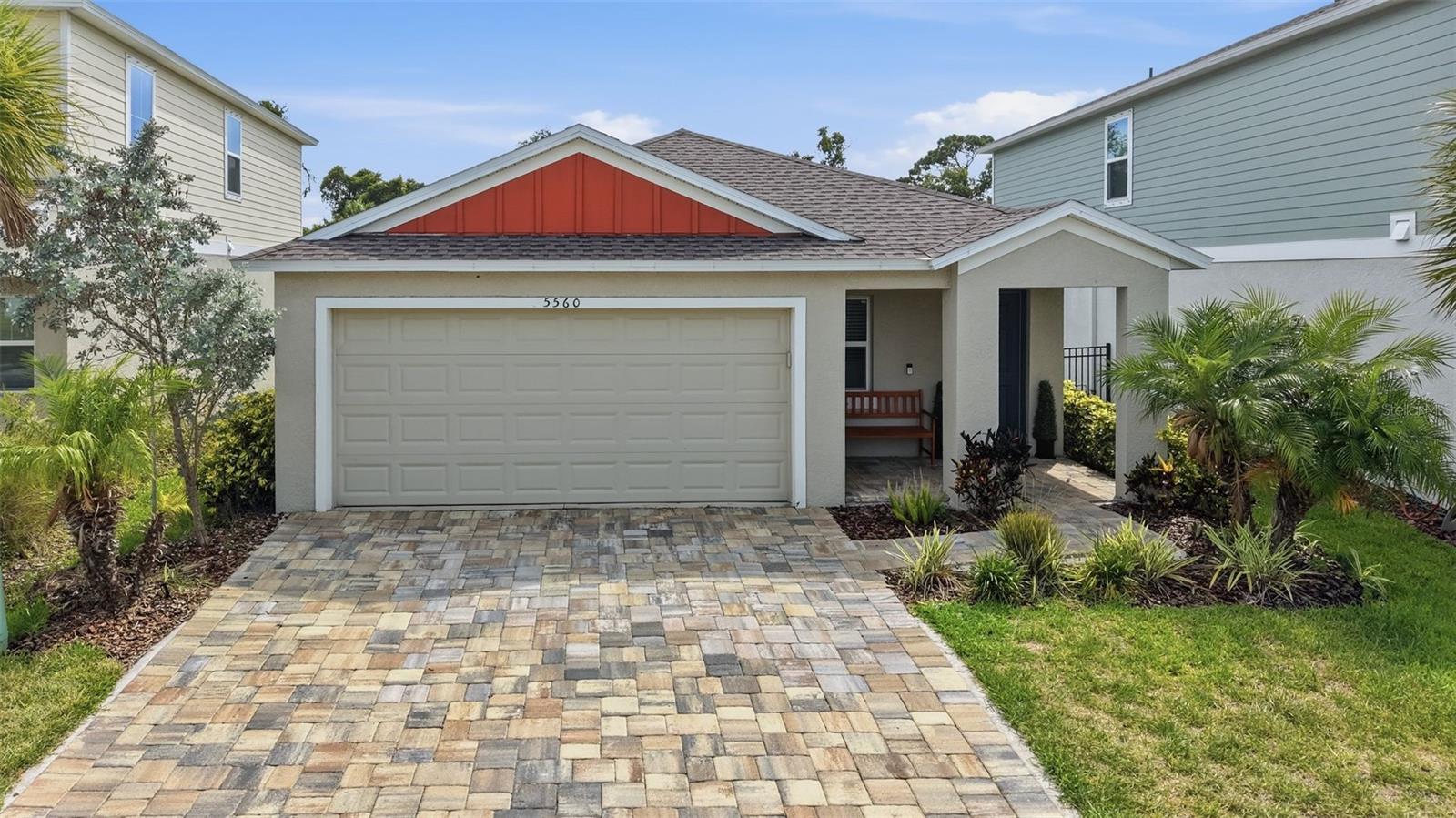 Why wait to build when you can move into a beautifully upgraded home with premium water and conservation views today?

Welcome to 5560 Summer Sunset Drive, a meticulously maintained 3-bedroom, 2-bath home nestled in the highly sought-after Waterset community of Apollo Beach. From the moment you arrive, you'll appreciate the attractive paver driveway, inviting front porch, and charming curb appeal.

Inside, you'll discover an open-concept floor plan with soaring ceilings, abundant natural light, and luxury vinyl plank flooring throughout the main living areas. The spacious kitchen features stainless steel appliances, ample cabinetry, a large island, and seamless flow into the dining and living spaces- perfect for entertaining family and friends.

The owner's retreat offers a peaceful escape with a spacious ensuite bath: dual vanities, oversized walk-in shower, and an impressive custom walk-in closet designed to maximize storage and organization.

Step outside and experience what truly makes this home special. Enjoy your morning coffee or evening sunsets from the covered lanai overlooking a fully fenced backyard with an extended paver patio, tranquil pond views, and a beautiful conservation backdrop. With no immediate rear neighbors, you'll enjoy a level of privacy rarely found in today's new construction communities.

Located in Waterset, residents enjoy resort-style pools, fitness centers, walking and biking trails, dog parks, playgrounds, sports courts, and a vibrant calendar of community events. Conveniently located near shopping, dining, marinas, and easy access to Tampa, St. Petersburg, and Florida's Gulf Coast beaches.

This is Florida living at its finest. Schedule your private showing today before this exceptional home is gone.