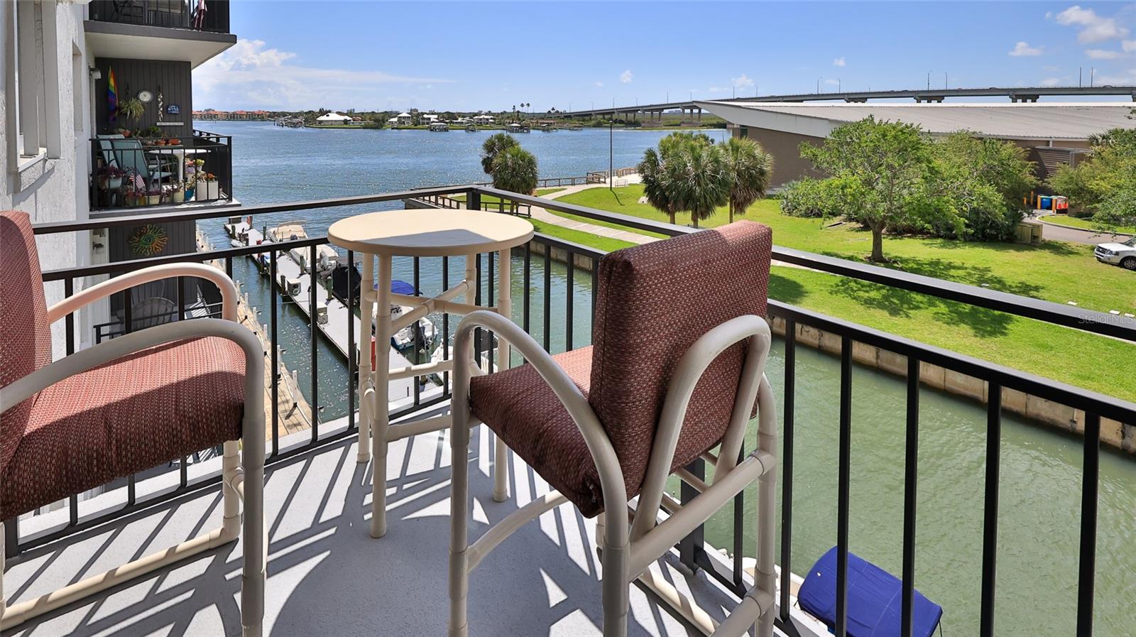 Picture front-row seats to fireworks and the annual boat parade, all from your own waterfront enclave. This 2-bedroom, 2-bath condo spans 1,000 square feet of beautifully reimagined space, freshly remodeled last year with new bath finishes, updated electrical, a new AC and water heater, plus a kitchen outfitted with all-new appliances including Induction Stove.
Smart design meets effortless style here. A built-in Murphy bed and integrated desk maximize every inch, making the floor plan as functional as it is inviting. Quality craftsmanship shows throughout, giving this turnkey home a polished, move-in-ready appeal.
Set within a highly sought-after 55+ waterfront community, residents enjoy a refreshing pool, community boat slips, and a calendar packed with social events. Stroll to nearby restaurants, art galleries, museums, and the lively community center, where live music drifts through the park on warm evenings.
The location is simply unbeatable. Historic Canal Street's boutiques and farmers market are minutes from your door, and iconic Flagler Avenue leads straight toward the sand. Emory L. Bennett Park sits just steps away, while the Marine Discovery Center offers eco-tours and lagoon adventures barely a half-mile north. Grab essentials at nearby Stores, then explore JB's Lagoon Adventures or the local dog park.
With easy access to highways and beaches, plus the charm of riverside living, this condo delivers a vibrant, connected lifestyle. Come claim your slice of New Smyrna Beach—where every day feels like a celebration.