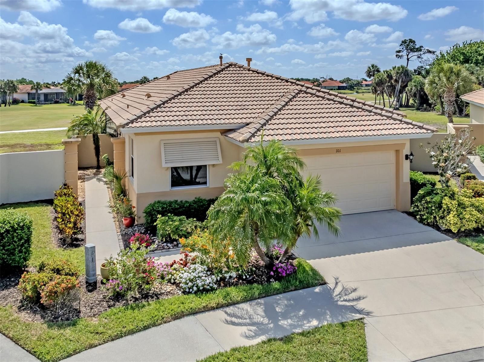 Experience the ideal blend of luxury, comfort and serene surroundings in this quality-built WCI Rosa model home, in a tropical setting with stunning water and golf course views. At the end of a quiet cul-de-sac, this maintenance-free home offers peace, privacy, and an exceptional lifestyle. Featuring two bedrooms plus a versatile den and two full baths, this home is designed for both relaxation and functionality. The spacious layout includes large side yards, providing added privacy. The expansive primary suite is a retreat, complete with a walk-in closet, dual sinks, a soaking tub and a separate shower. The beautifully appointed kitchen boasts granite countertops, a gas range, rich cherry cabinets and a charming eat-in area, ideal for casual dining. Throughout the home, you’ll find upgraded tile flooring in the living areas and baths, along with recessed lighting that adds a warm and inviting ambiance. The open great room floor plan is ideal for entertaining or simply enjoying everyday living, offering flexibility to suit any lifestyle. Residents of the Venetian Golf and River Club enjoy access to an array of resort-style amenities, including miles of scenic sidewalks, a nature trail, two pools, tennis courts, pickleball courts, a fitness center, exercise classes, dining options and a lively tiki bar. Golf enthusiasts will appreciate the 18-hole championship course and impressive clubhouse. This residence is conveniently near shopping, Interstate 75, beautiful Gulf beaches, charming Venice, Sarasota Memorial Hospital, Venice location and easy access to Sarasota. Don’t miss your opportunity to own a slice of paradise.