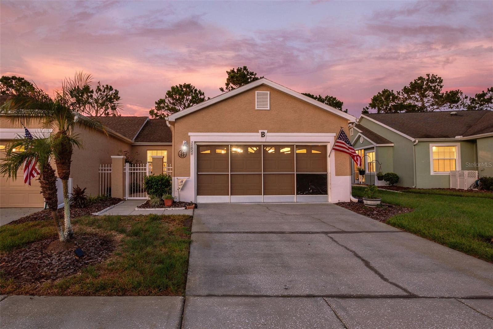 Active Adult (55+) Golf Community featuring a 18 hole Par 65 Course. Additional community features: Driving Range, Pro-shop, Restaurant, Ballroom, Fitness Center, Resort Style Heated Pool and Spa, Tennis courts, Pickleball, Shuffleboard, Bocce Courts, Dog park, and many miles of walking paths through beautiful tropical Florida. Take your golf cart and go shopping at the convenient Publix Shopping Center located near the gated entrance to the community. Welcome to a relaxed Lifestyle!
The Groves HOA takes away those burdensome exterior chores. Full lawn service for the whole community, reclaimed water irrigation, exterior painting, roof replacement (replaced 2024), community pool maintenance, Cable TV, Internet, entry gate security, and maintenance on Clubhouse and other structures and parks leaving more time to enjoy all these available amenities. 
How to briefly describe the quality and care of this home is very difficult. Did you ever wish the you could find a home move-in ready; well, you have. No deferred maintenance here. Every detail and upgrade shows pride of ownership. Start your tour through the screened courtyard paver floor entranceway; even the entry door is meticulous and inviting. Upon entering the foyer you will look straight through the unit to the 14th T-box and fairway of the beautiful golf course. What a view! Notice the trey ceiling and crown molding of the dining room 12x9'10 and adjoining living room 12x13 complete with alcove for TV. Exit to the 17 x 26 feet screened lanai with pavers and then pause to enjoy the beauty of the magnificent scenery. Then back inside to the 13x13.4 Primary Bedroom located on the rear of the unit and overlooking the golf course through a beautiful bay window. The primary bathroom is completely tiled and features a wheelchair accessible shower and double lavatory vanity. The Primary suite features a walk-in closet which is 6'11x7'8, and quite roomy. Bedroom 2 (12.8x10'4) is split from the Primary area and has access to Bath #2, additional media nook/storage (5.8x8.4) off hallway to 2nd BR. Back to the well designed kitchen and dining nook (9.4x18) with sink overlooking the golf course (of course). Fully equipped kitchen complete with reverse osmosis water supply in kitchen and an installed water softener system for the whole house, Corian countertops, nice cabinetry, and upraded appliances. The 20x20 garage is screened and is home to the included washer and dryer. There is attic access and has a large floored area for storage. Gutters all around, rear gutters have leaf guard system. Hurricane screens for back side of home and west windows also. Solar blinds for family room and lanai. Every entrance and majority of the house is wheelchair accessible, except for the kitchen. There's more, come see for yourself.