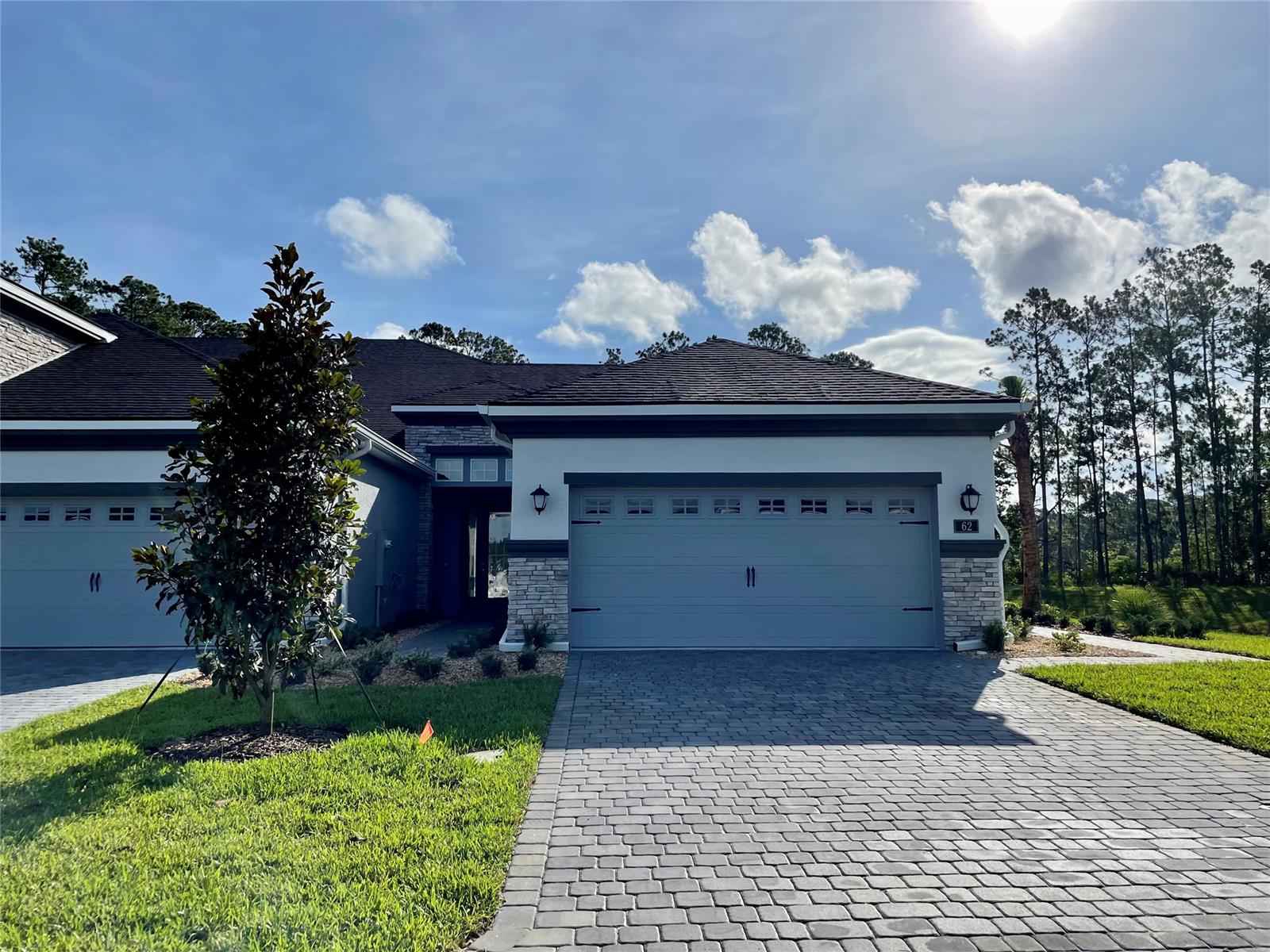 BRAND NEW CLUB VILLAS ON THE LAKE UNDER CONSTRUCTION Ready spring 2022. Located in GATED community of Plantation Bay! Enjoy MAINTENANCE FREE living in The Arbor II. Dining & Family room w/ sliders leading to covered screened lanai. Master bedroom boasts private bathroom, 2 walk in closets plus double sinks! Nicely appointed including 10' CEILINGS, 42'' CABINETS, SS appliances, tile in main living area, paver driveway & more! Sub. Assoc. of 160./month includes, lawn, irrigation maintenance & roof.  HBW Home Warranty. ;Water: City