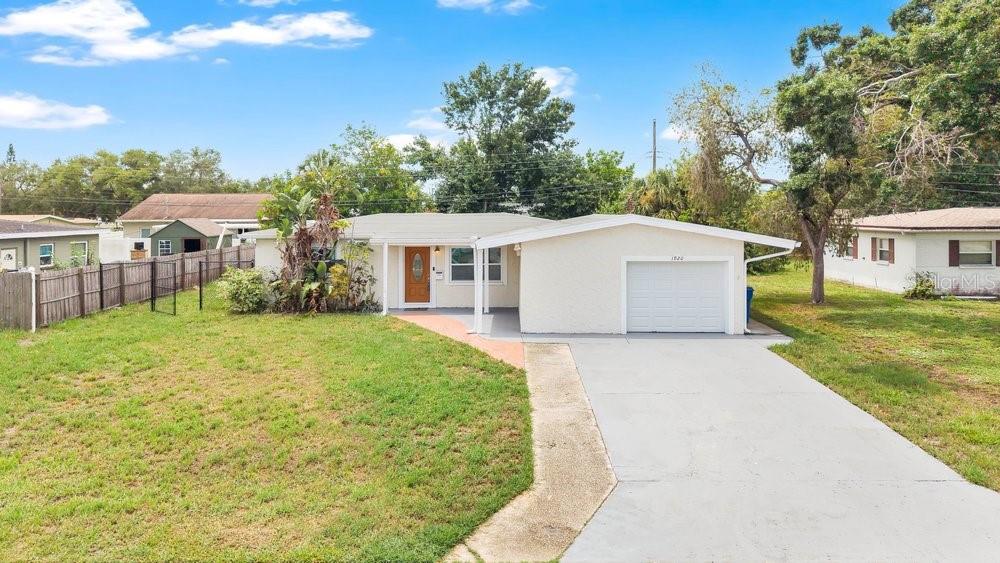 LOCATION, LOCATION, LOCATION! Situated in the highly coveted Meadow Lawn neighborhood, this home offers unparalleled convenience. You’ll find yourself just a quick 5-minute drive from the 4th Street Corridor—home to an array of retail shops, parks, dining establishments, and I-275 access—while the bustling downtown St. Petersburg arts and entertainment district, including the iconic Pier, is only 20 minutes away. This solid block-construction property is situated in a NO FLOOD ZONE and comes complete with an extensive list of upgrades. Recent improvements include a brand-new 50-gallon water heater 2026, roof replaced in 2024, AC 2018, modern flooring, and updated windows. The interior boasts a updated kitchen with granite countertops and stainless steel appliances, designer tiled bathrooms, elegant crown molding, and contemporary lighting. The versatile split-bedroom layout is complemented by an expansive 75x100 lot, featuring a fully fenced backyard with a large storage shed. Whether you have a boat, an RV, or multiple vehicles, the oversized driveway and garage provide ample space for your needs. This turnkey property truly checks every box and the one you have been waiting for—schedule your private showing today before it’s gone!