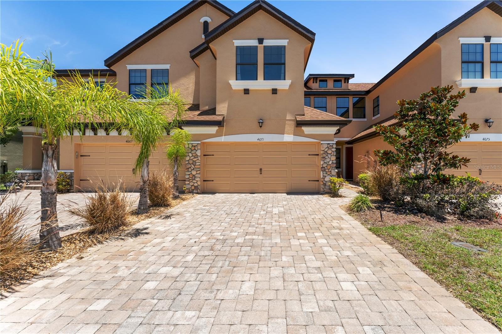 Welcome to gated Maple Glen, where style, space, and water views come together in one of Wesley Chapel’s most convenient locations.

This beautifully maintained 3-bedroom, 2.5-bath townhome stands apart with tastefully selected Design Center upgrades and custom trim details that add character and sophistication throughout the home. The first floor features plank tile flooring, a spacious open-concept living area, and triple sliding glass doors that open to a covered, screened lanai overlooking the water—perfect for relaxing and enjoying the Florida lifestyle.

The kitchen is designed to impress with granite countertops, undermount sinks, 42-inch cabinetry with crown molding, stainless steel appliances, and a beautiful oversized center island that serves as the heart of the home. The upscale finishes continue throughout with granite countertops and undermount sinks in the bathrooms, creating a cohesive and elegant feel from room to room.

Upstairs, you'll find all three bedrooms, a versatile loft/flex space ideal for a home office, media room, or play area, plus the convenience of an upstairs laundry room. The spacious owner's suite features tray ceilings, a luxurious en-suite bath with a garden tub, separate shower, and plenty of room to unwind.

Additional features include a 2-car garage, a 2018 roof, 2018 A/C system, and access to Maple Glen amenities including a community pool, playground, and dog park.

Located just minutes from Seven Oaks, shopping, dining, top-rated schools, and everything Wesley Chapel has to offer, this move-in-ready home delivers the perfect combination of comfort, convenience, and Florida lifestyle.

Schedule your private showing today.